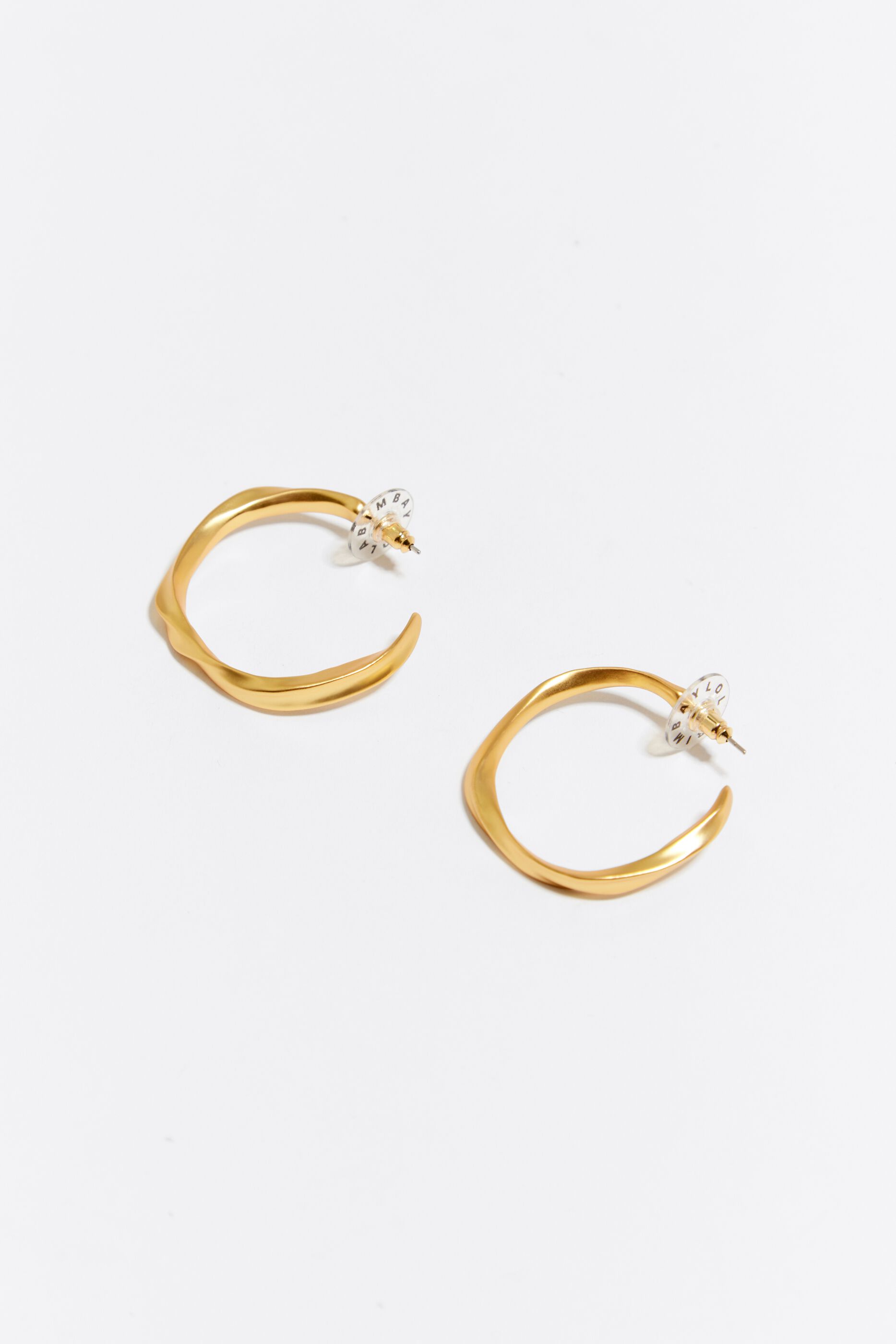 Maxi golden irregular hoop earrings