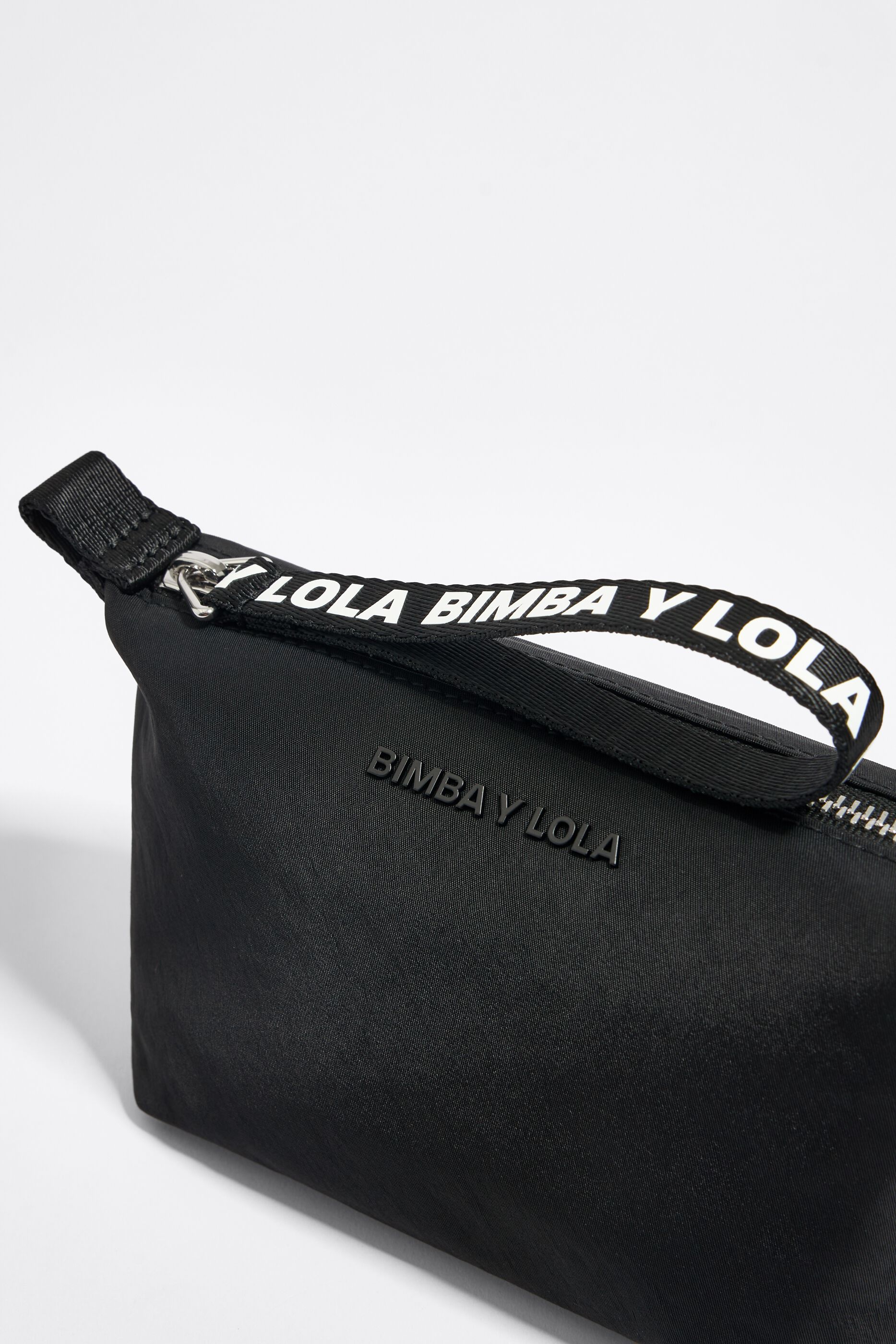 Small black nylon trapezium make-up case