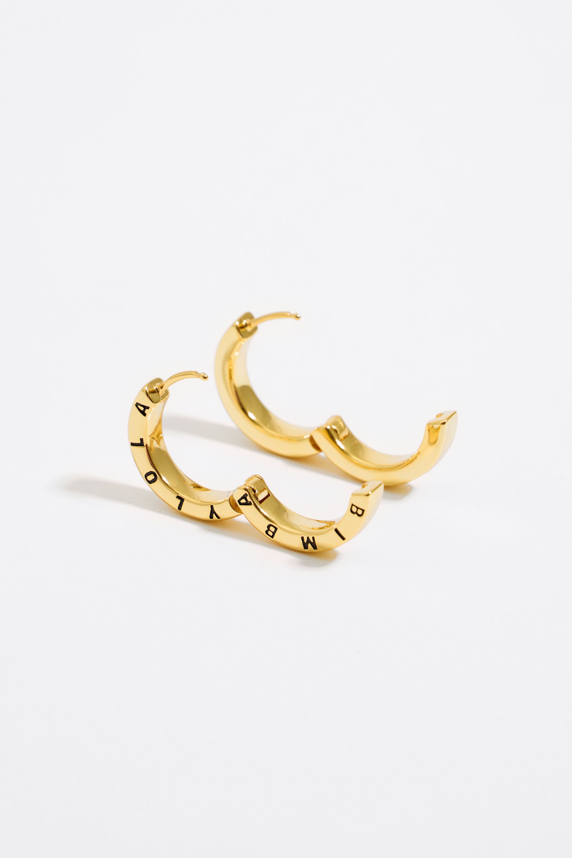 Black logo golden hoop earrings