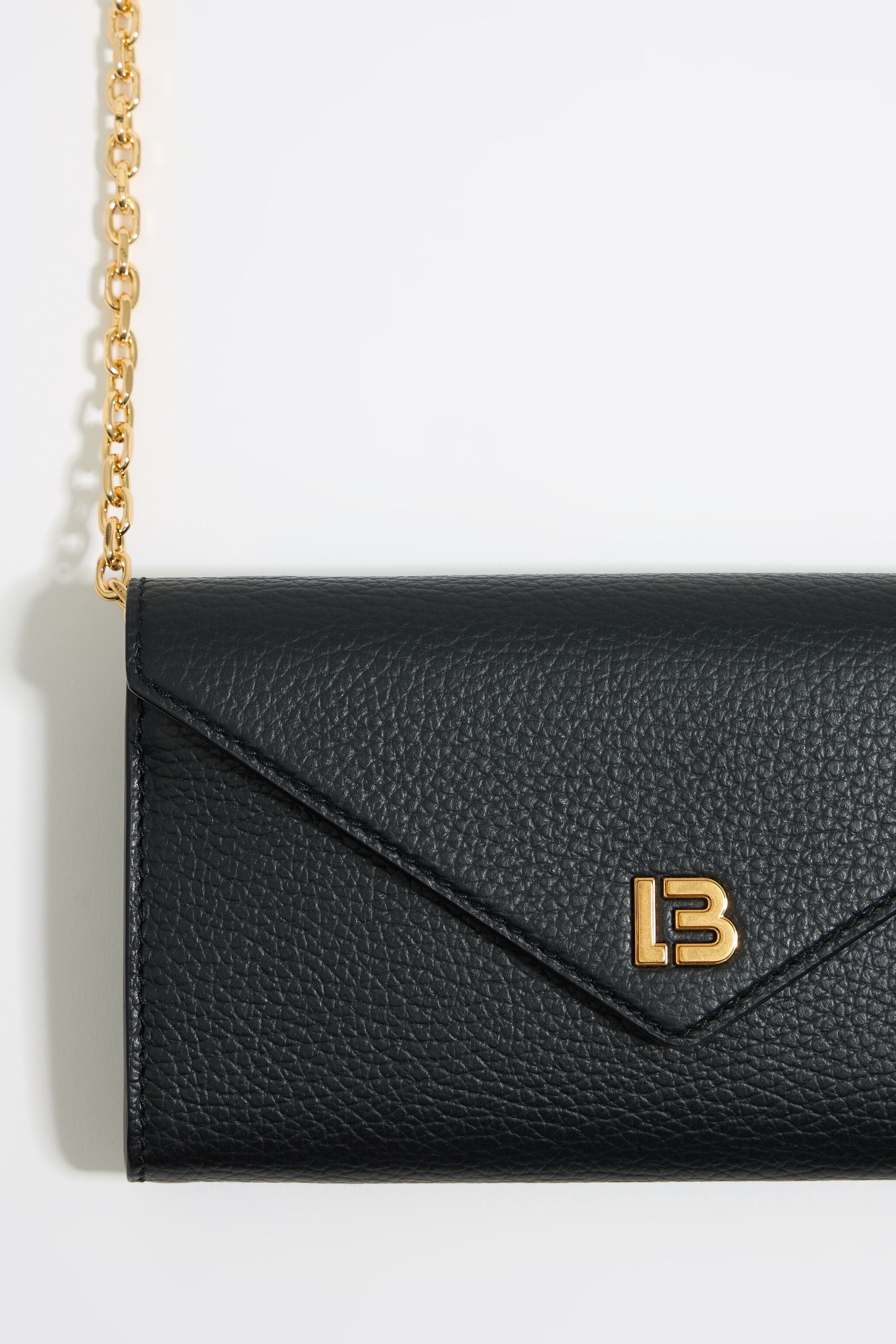 Mini black leather flap bag