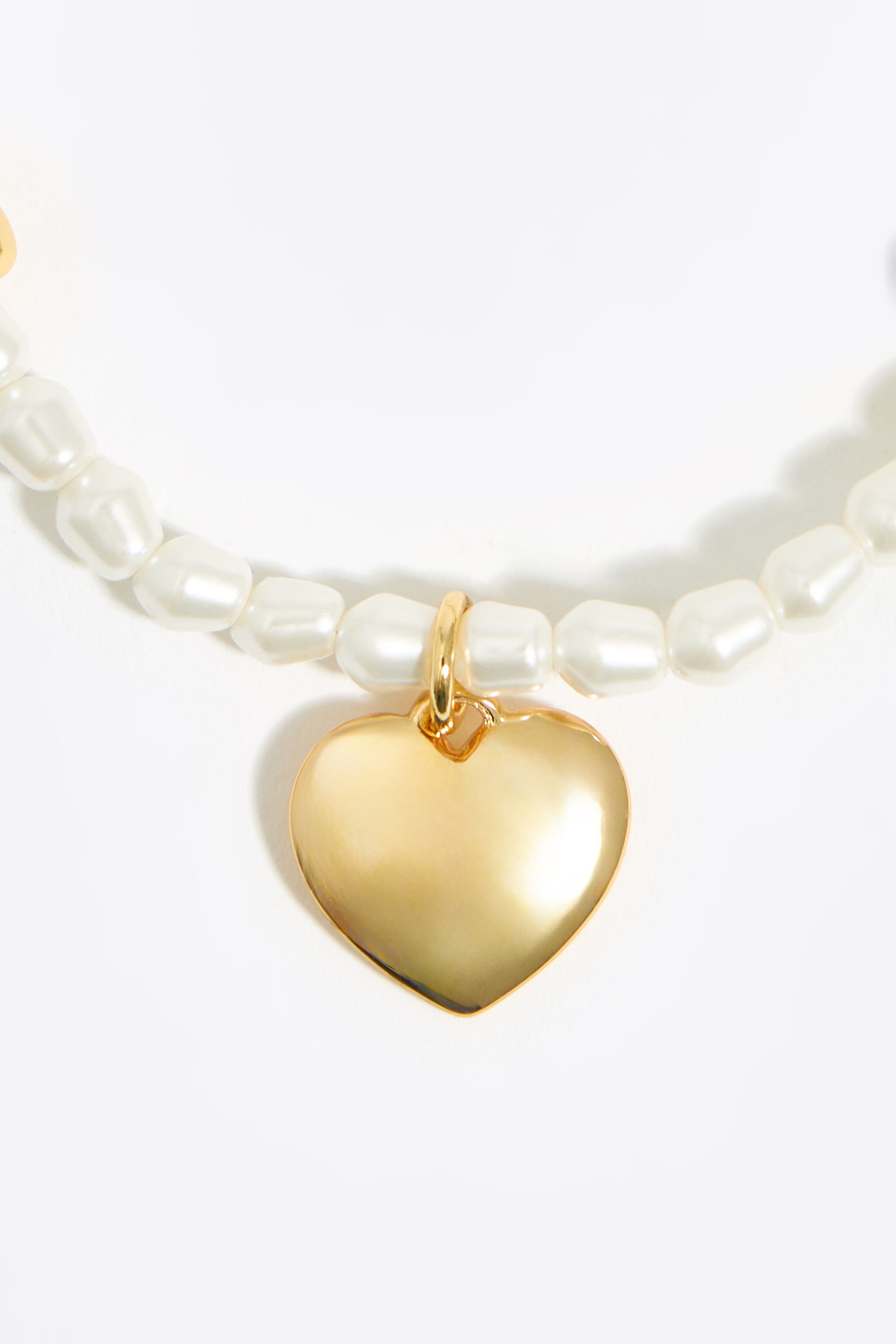 Gold hearts and pearls bracelet