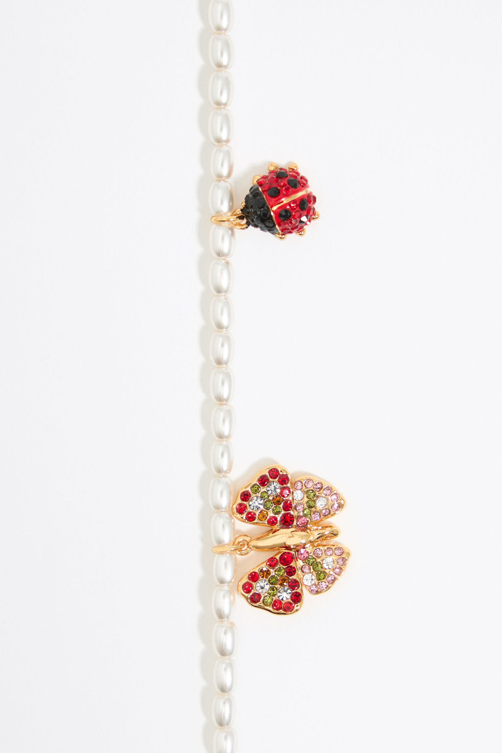 Pearl necklace with butterfly, ladybug and bee