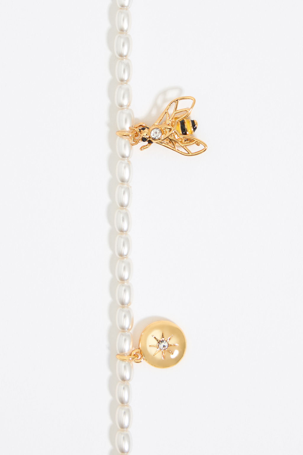 Pearl necklace with butterfly, ladybug and bee