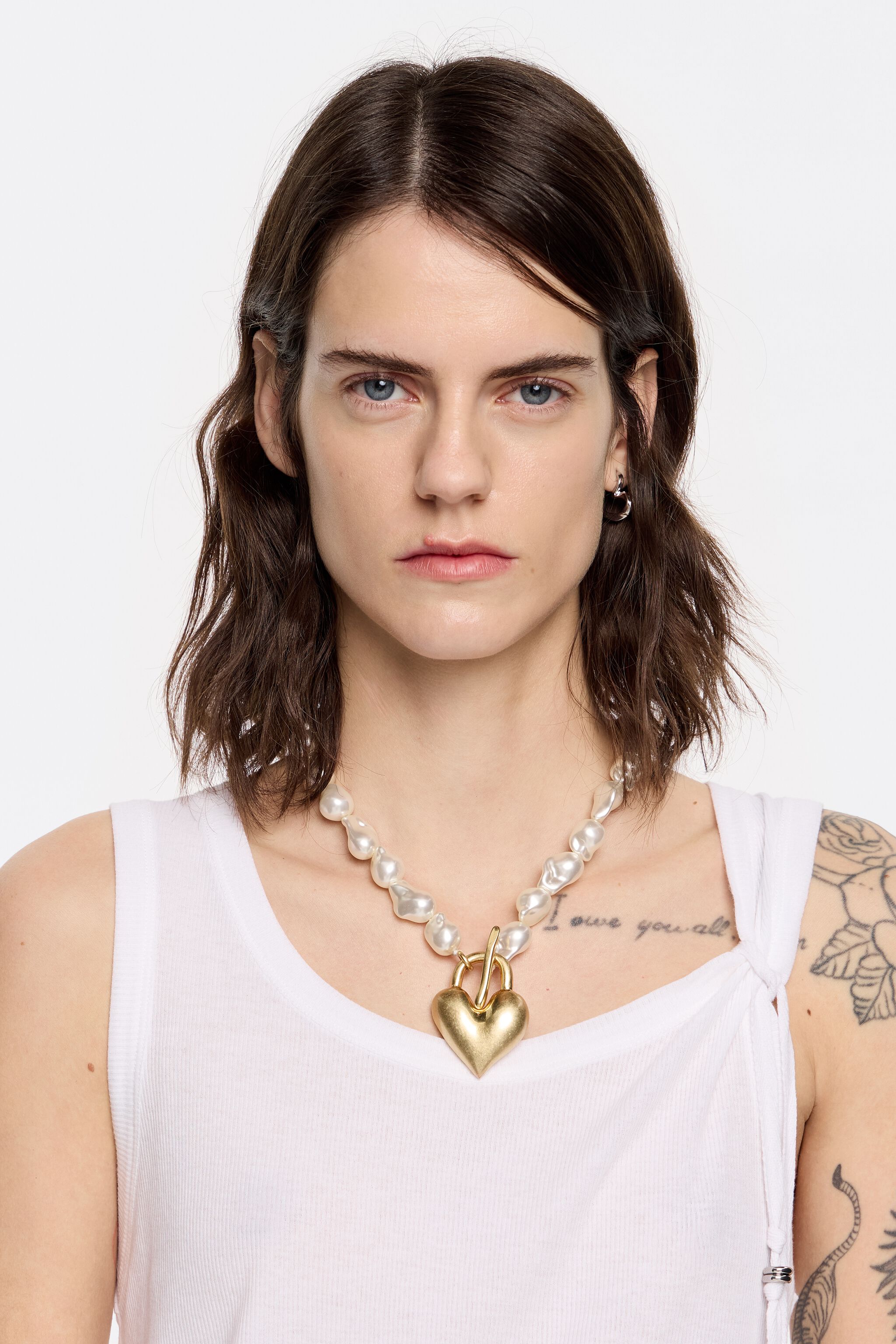 Necklace with pearls and a heart in matte gold