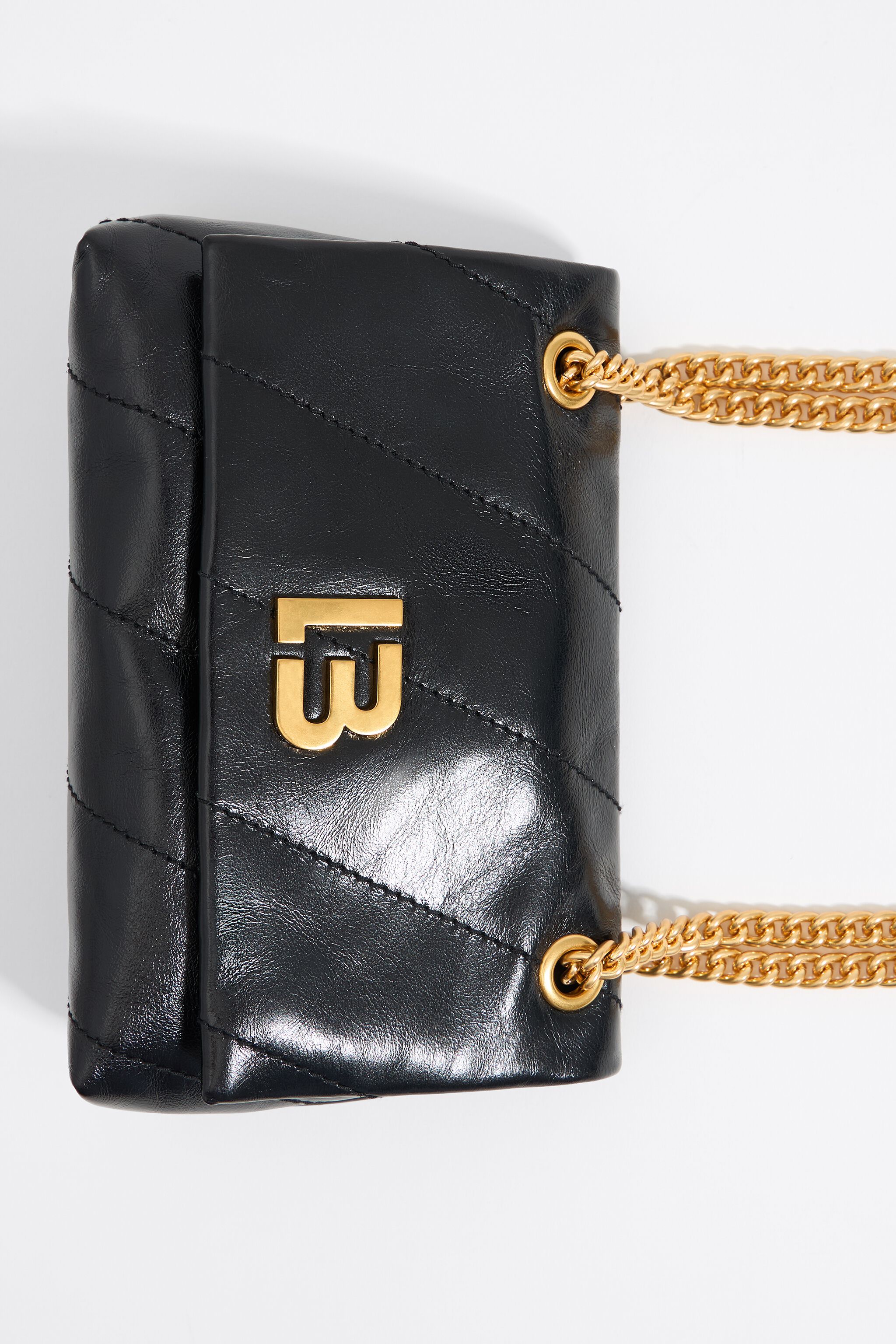 Mini black leather flap bag