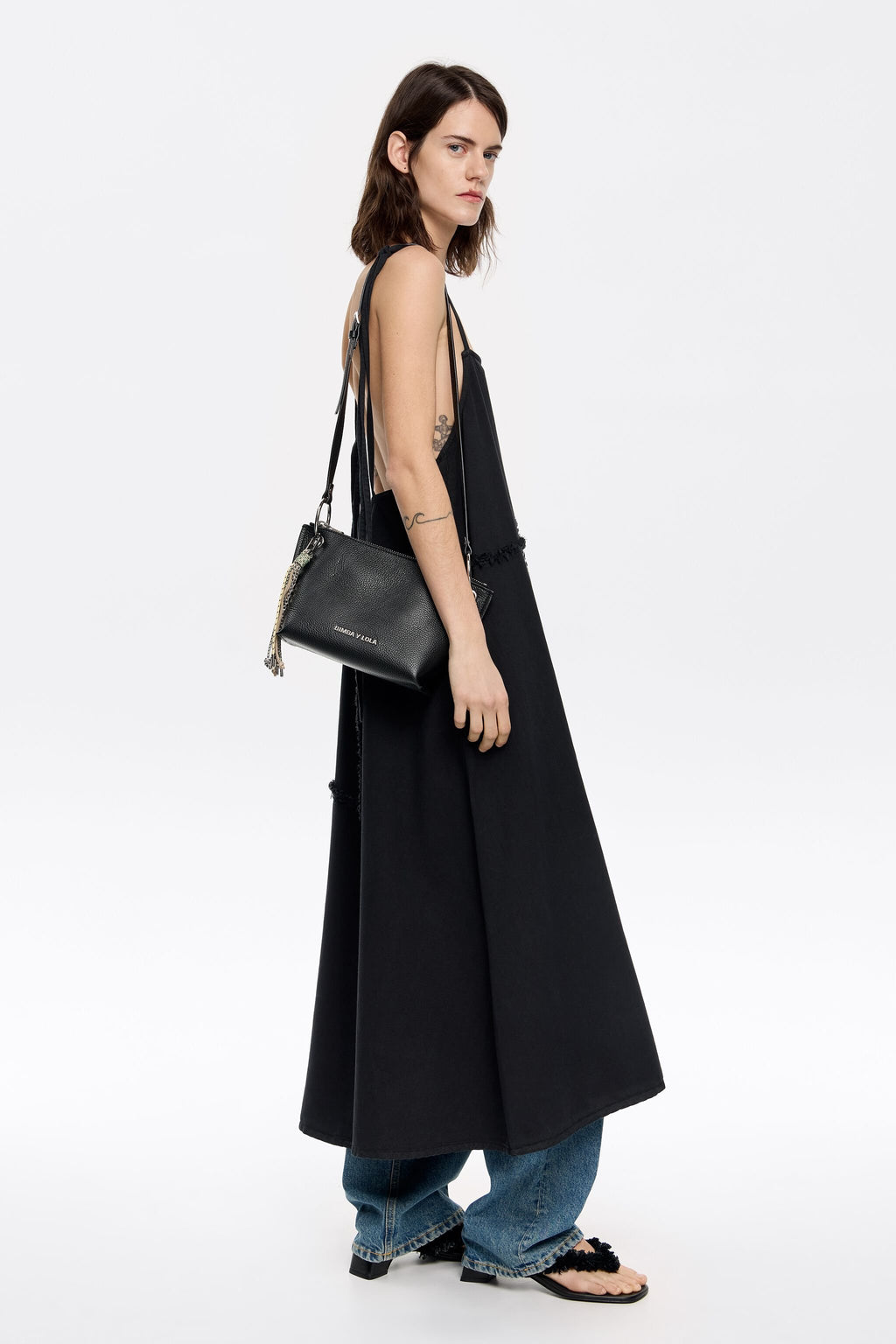 Medium black leather trapezium bag