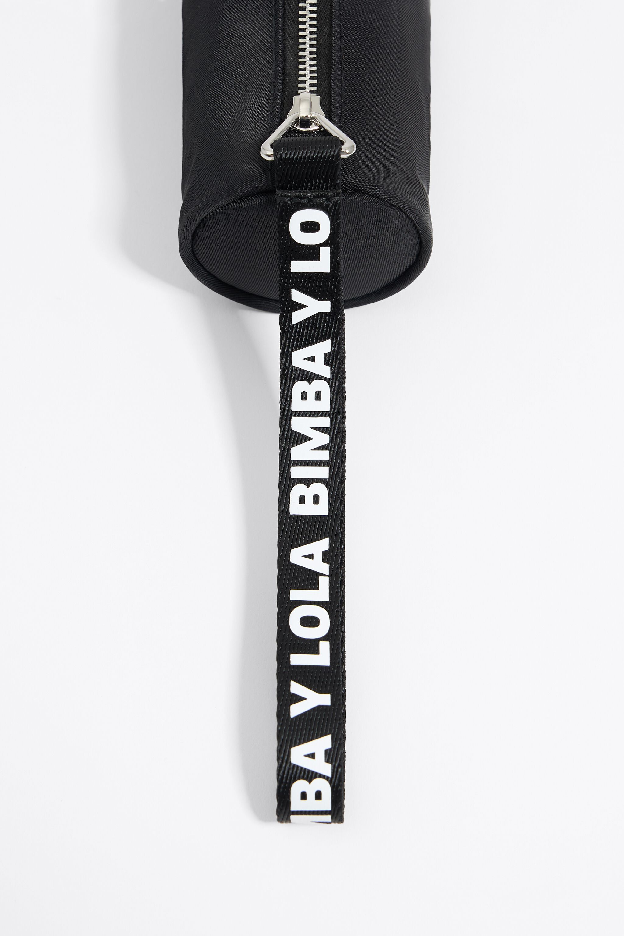 Black nylon cylindrical make-up case