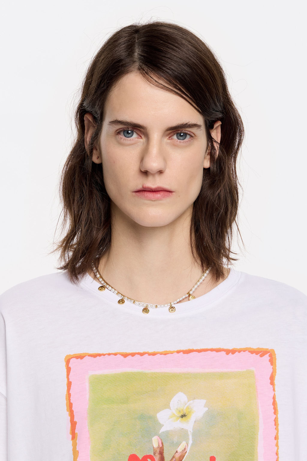 Gold coin logo and pearl necklace