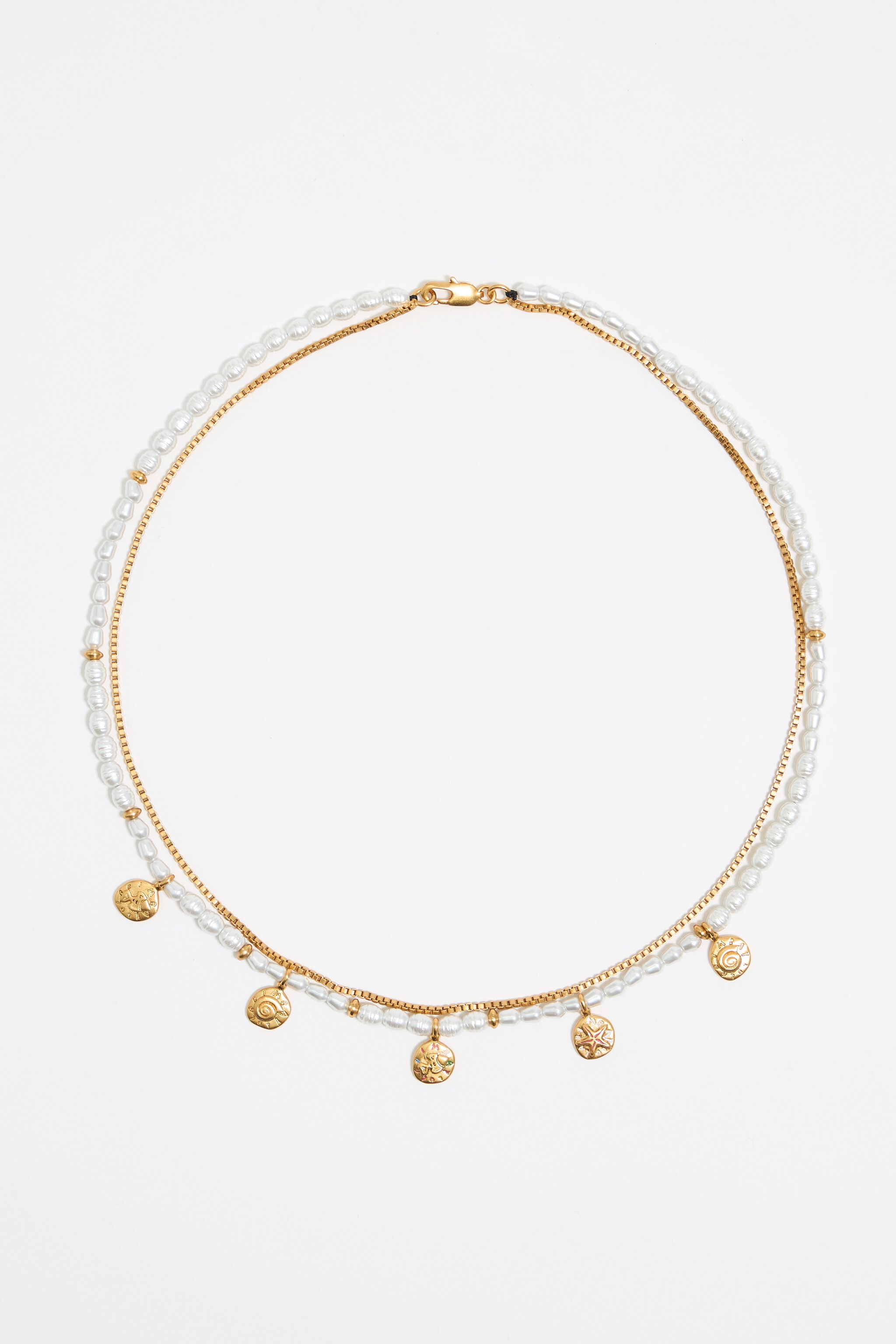 Gold coin logo and pearl necklace