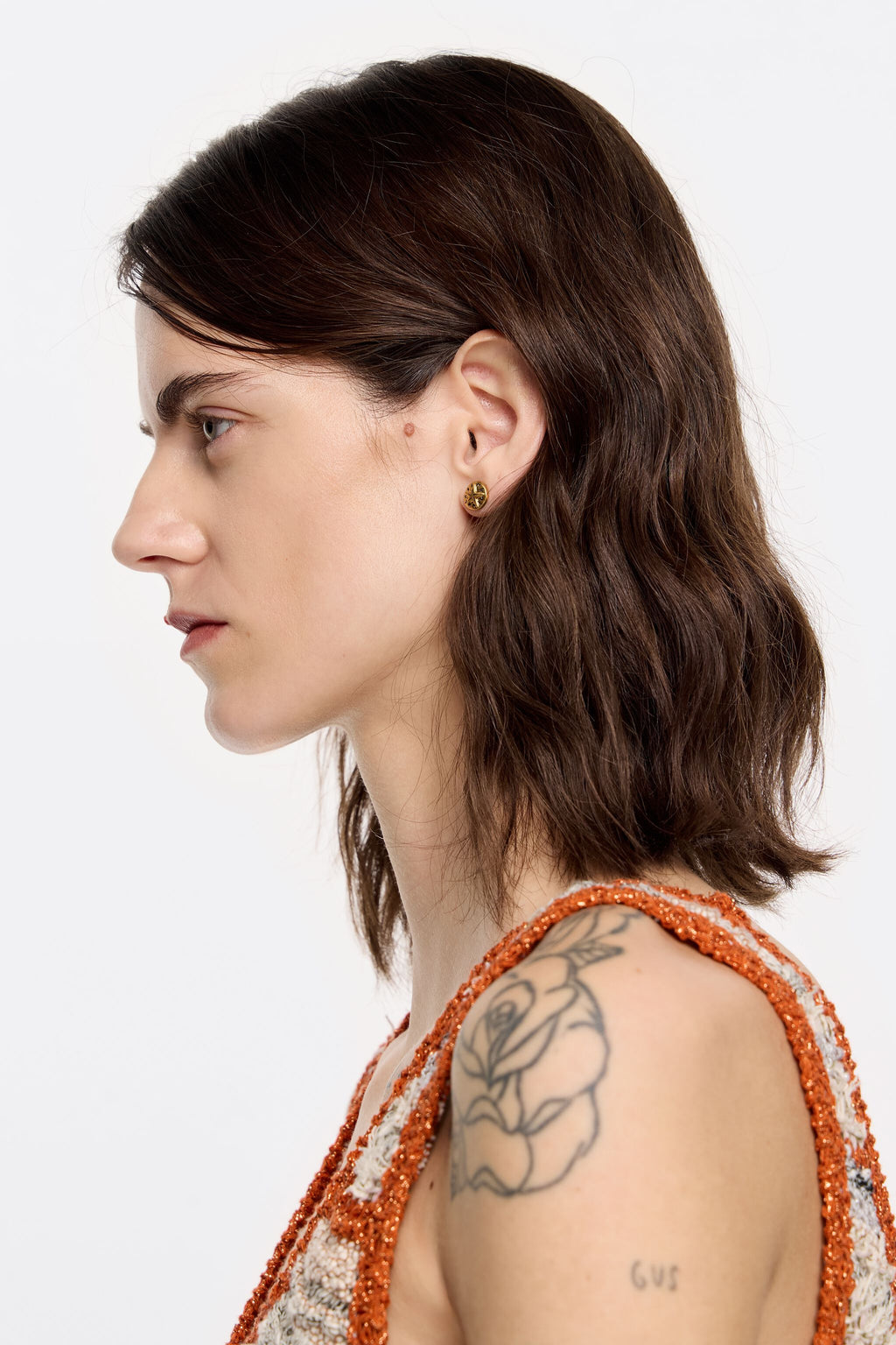 Gold coin logo earrings