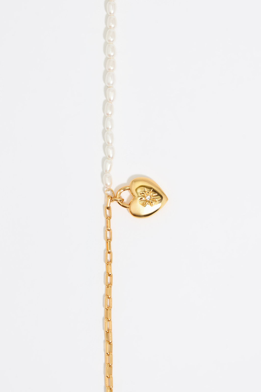 Gold chain and pearl heart necklace