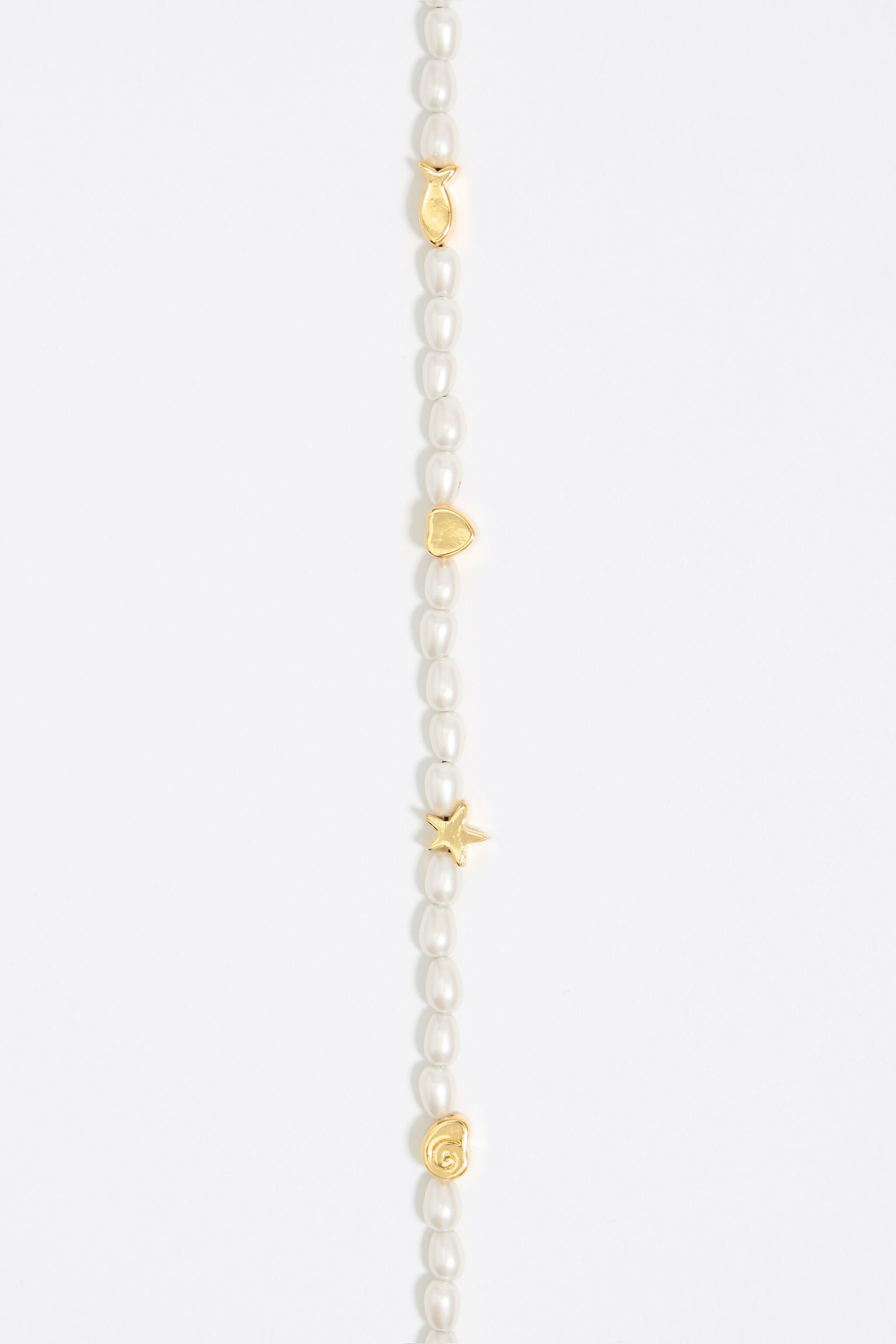 Gold marine motifs and pearl necklace