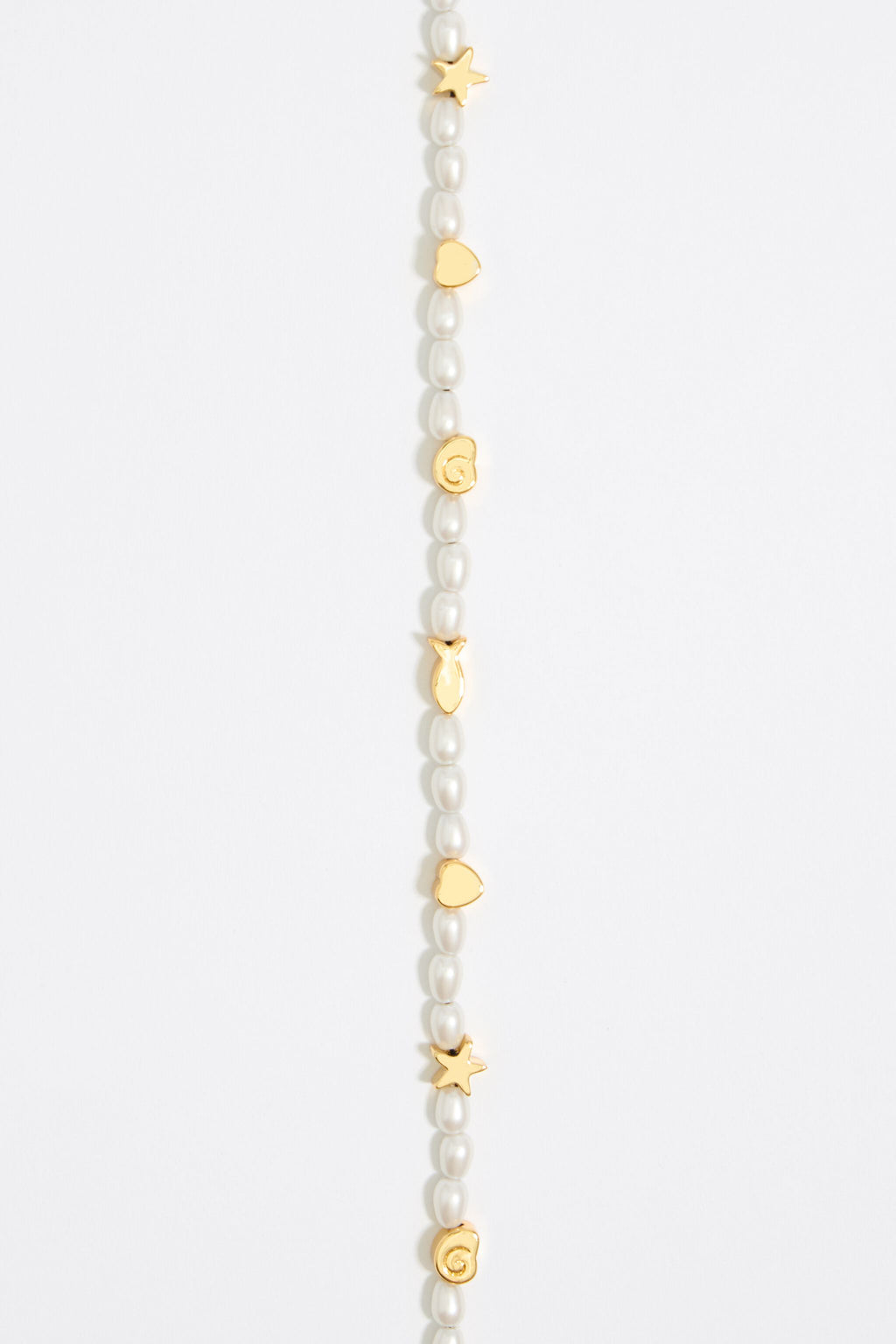 Gold marine motifs and pearl bracelet