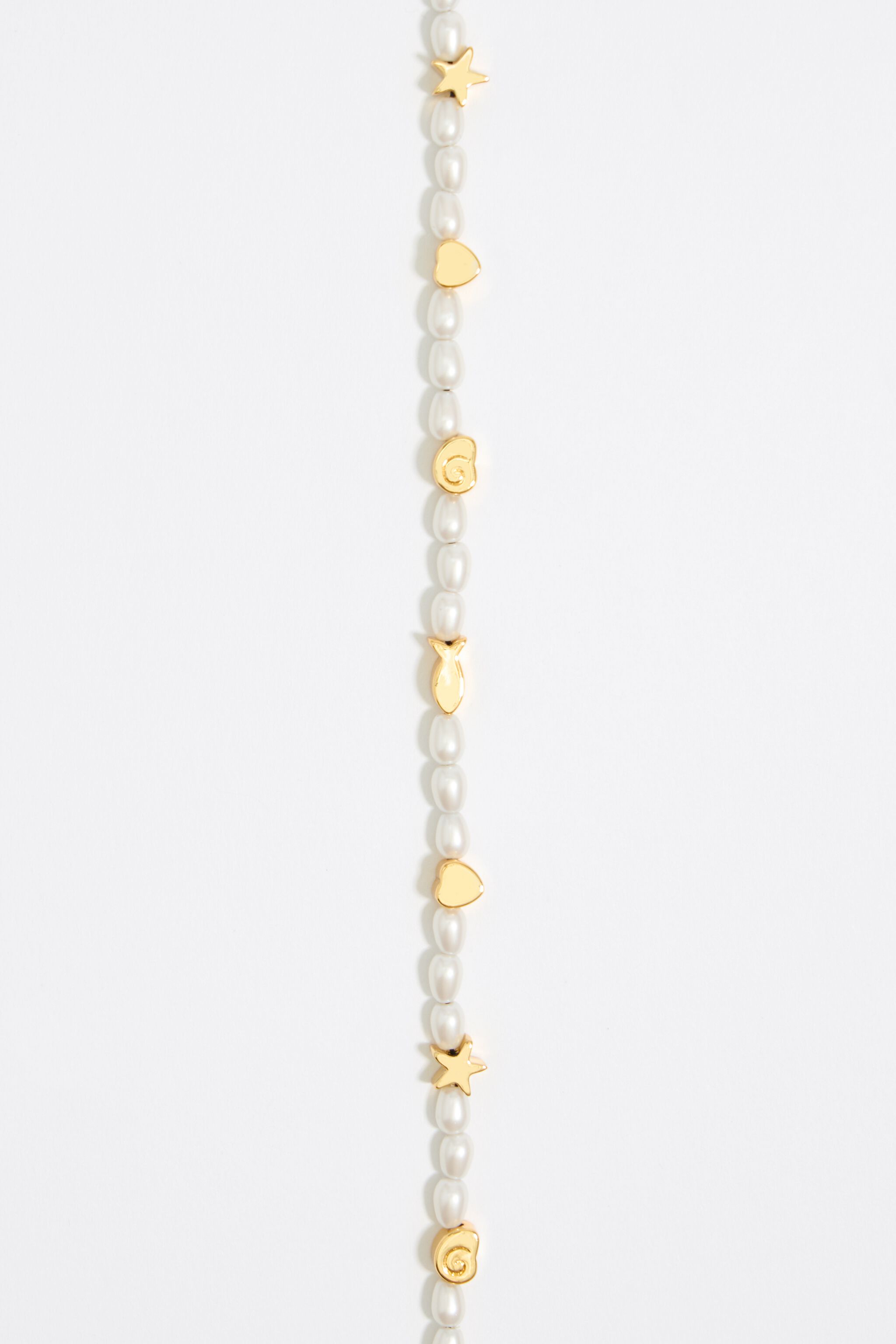 Gold marine motifs and pearl bracelet