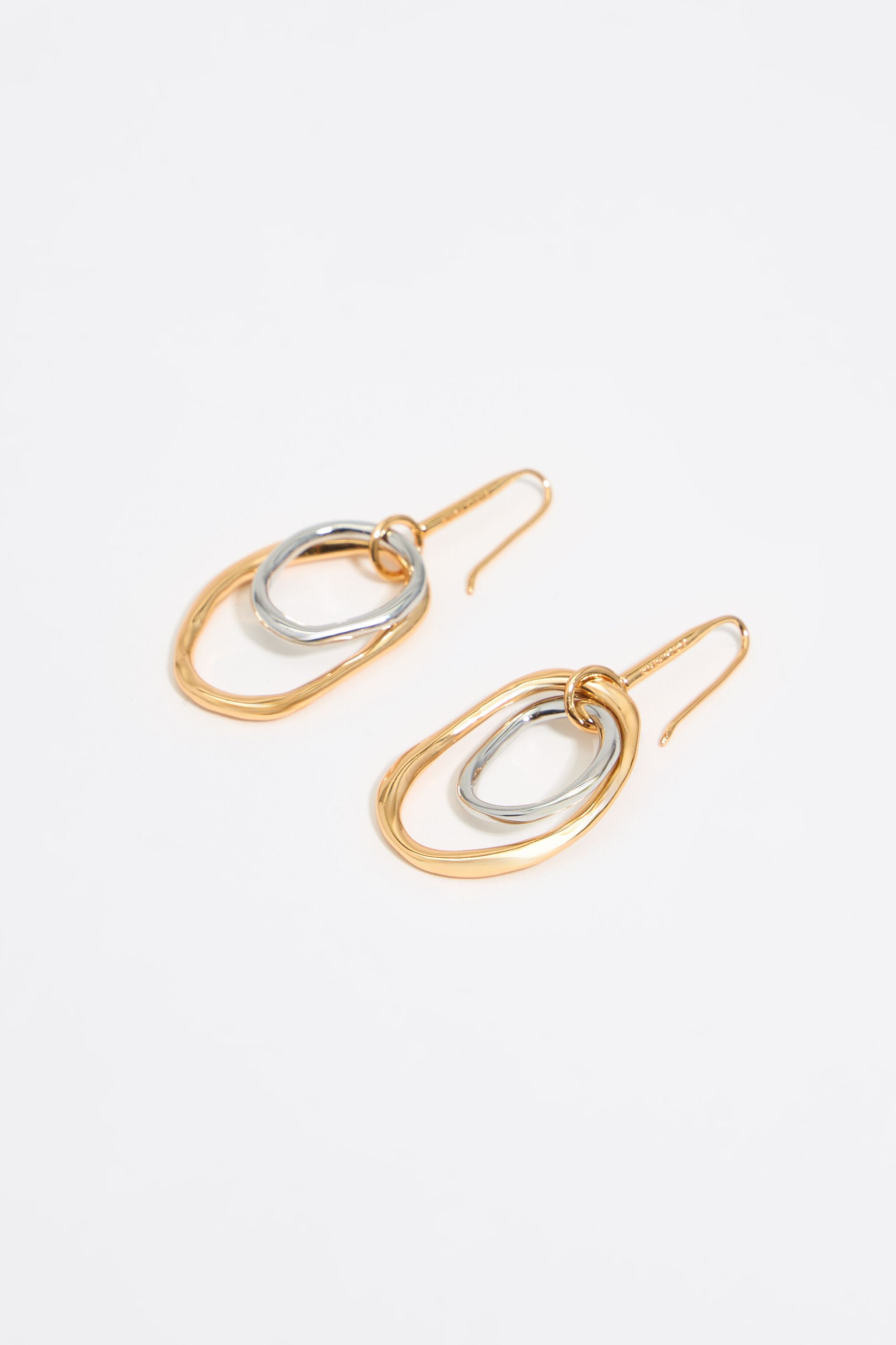 Textured gold and silver hoop earrings