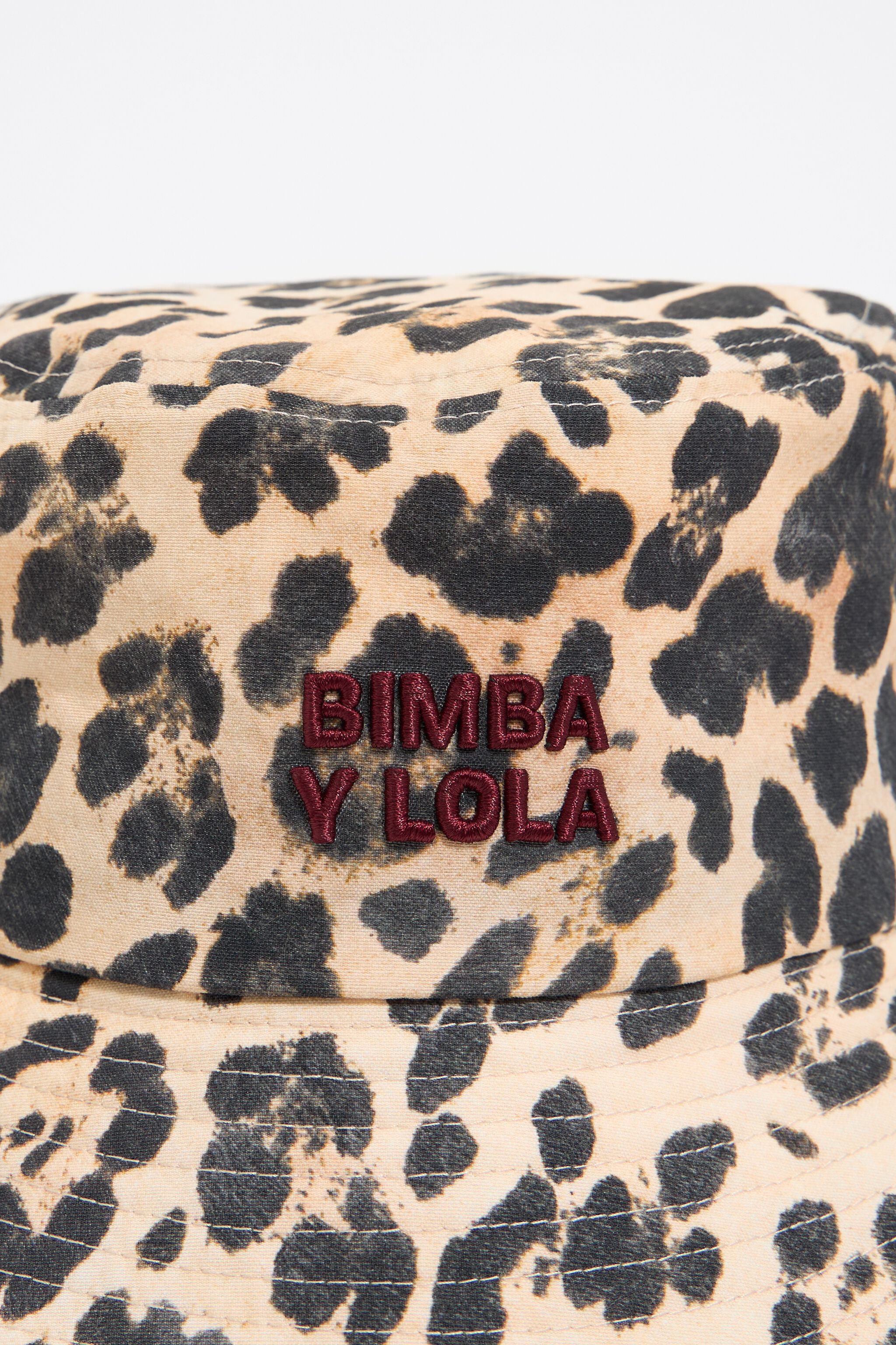 Ivory leopard trench bucket hat