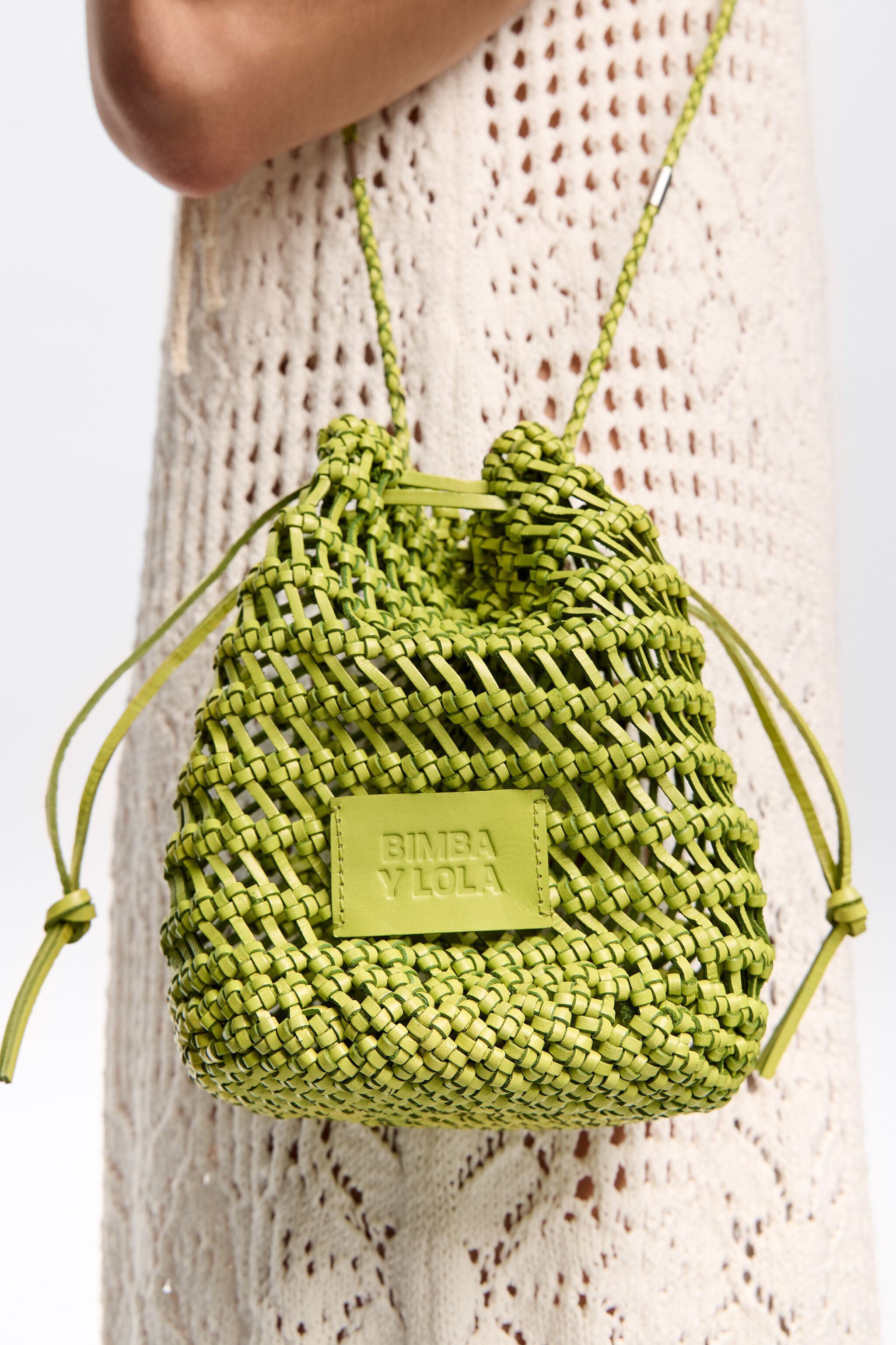 Small acid lime plaited leather bucket bag