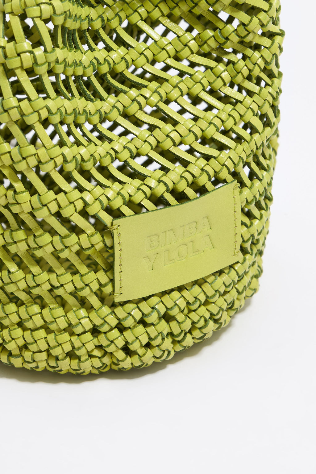 Small acid lime plaited leather bucket bag