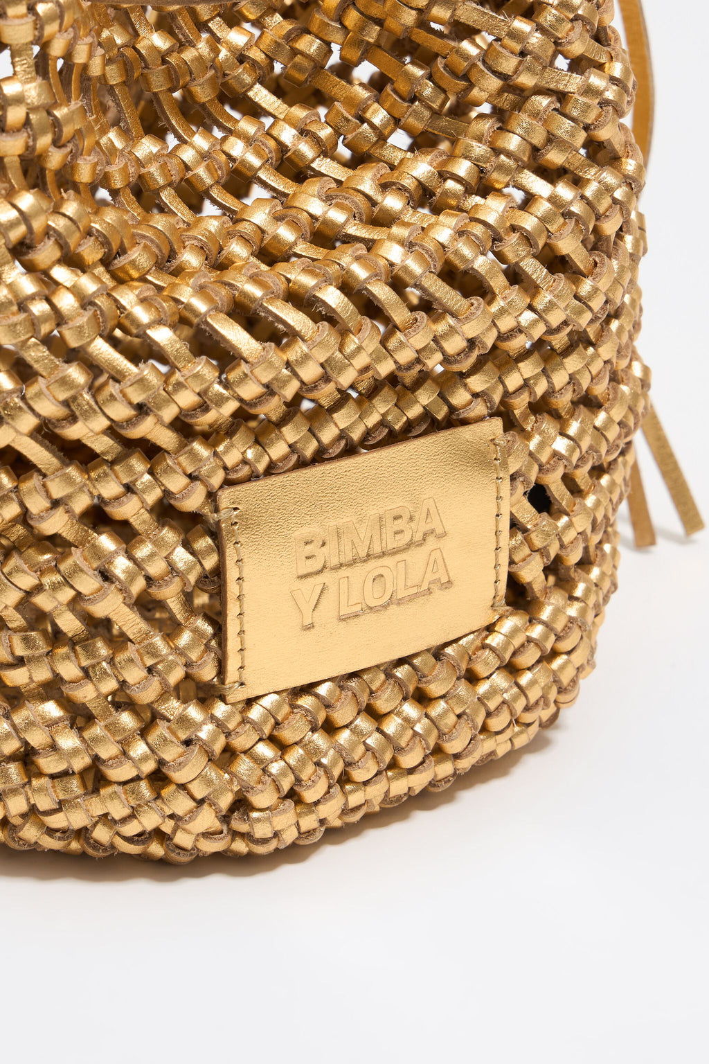 Small gold plaited leather bucket bag