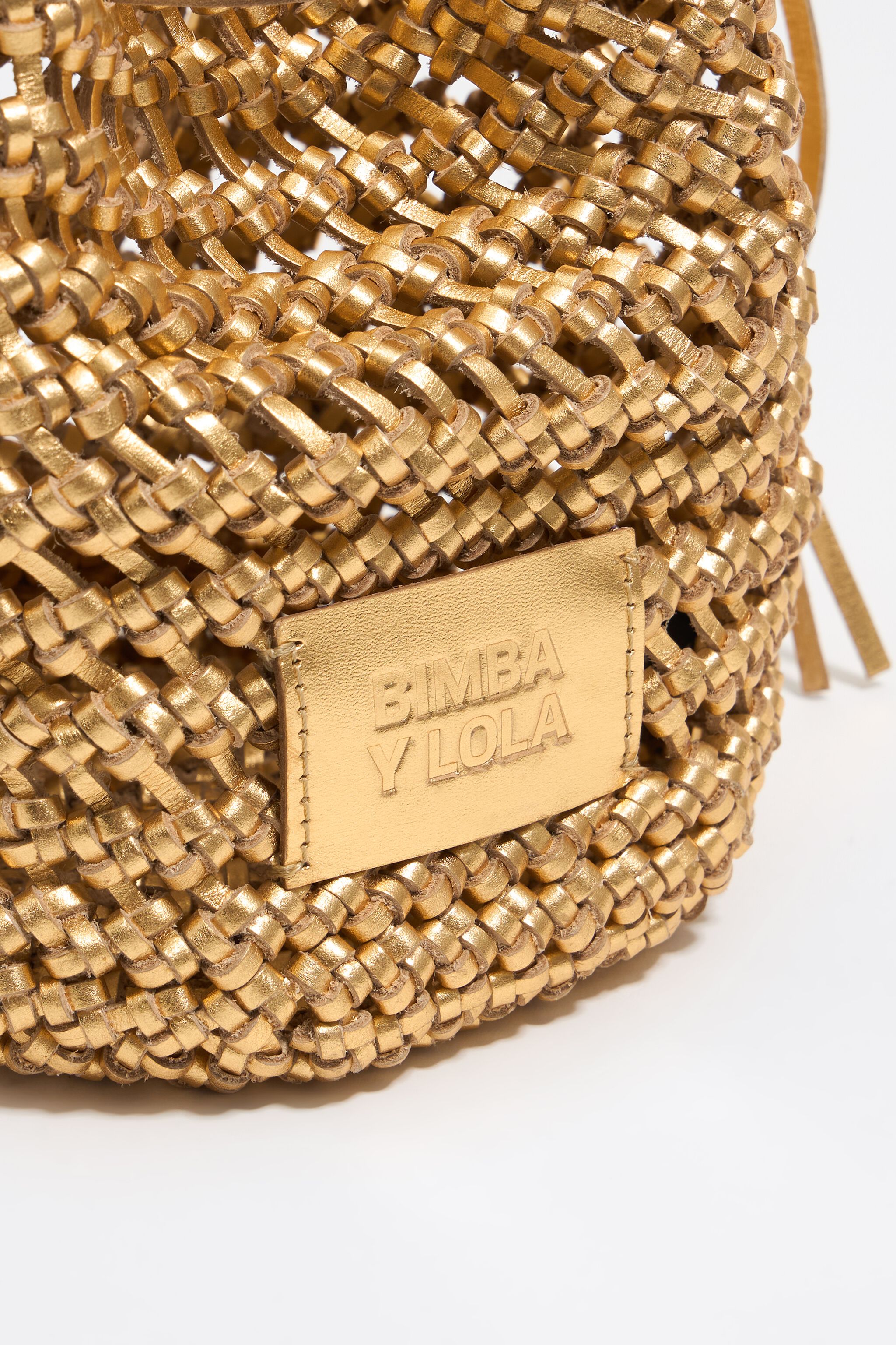 Small gold plaited leather bucket bag