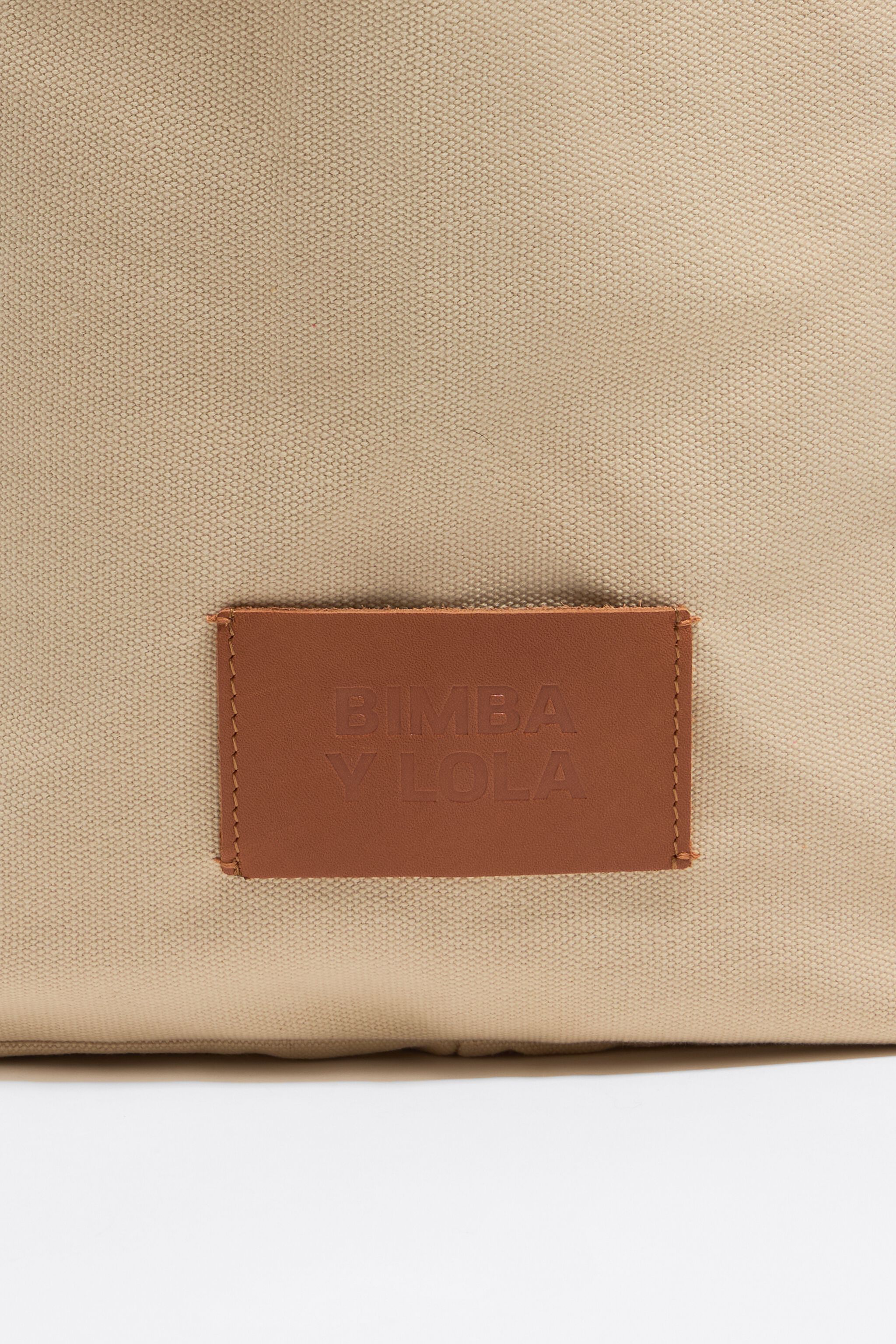 Large beige woven shopper bag