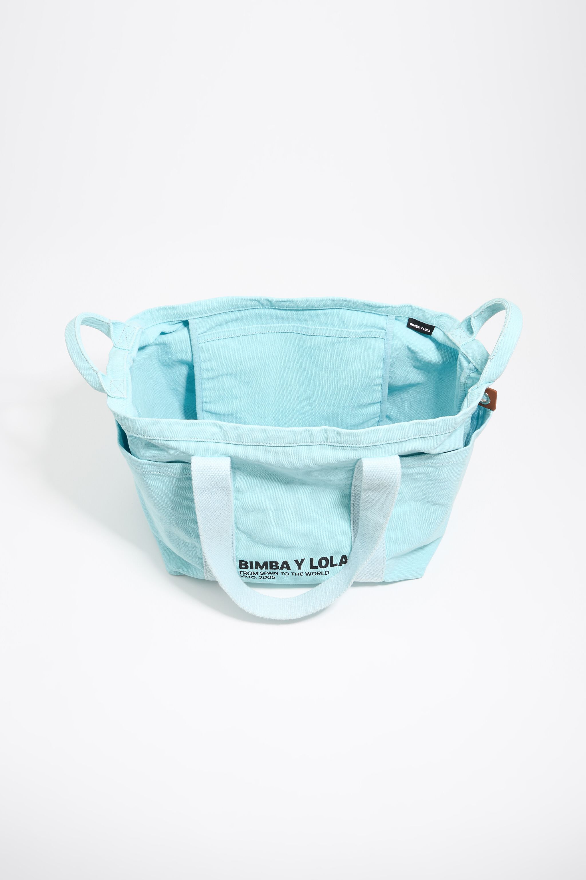 Large light blue woven beach bag