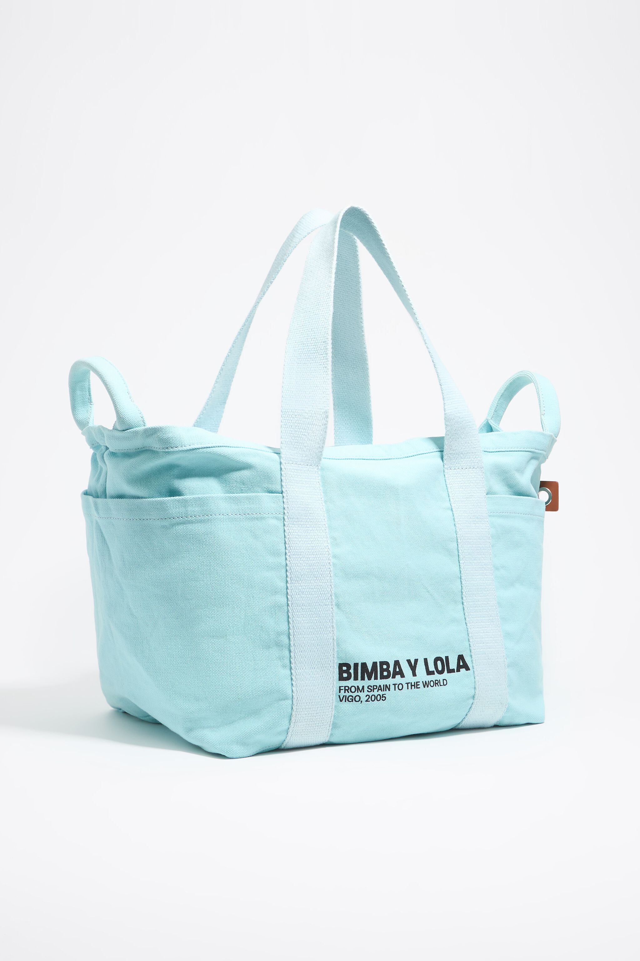 Large light blue woven beach bag