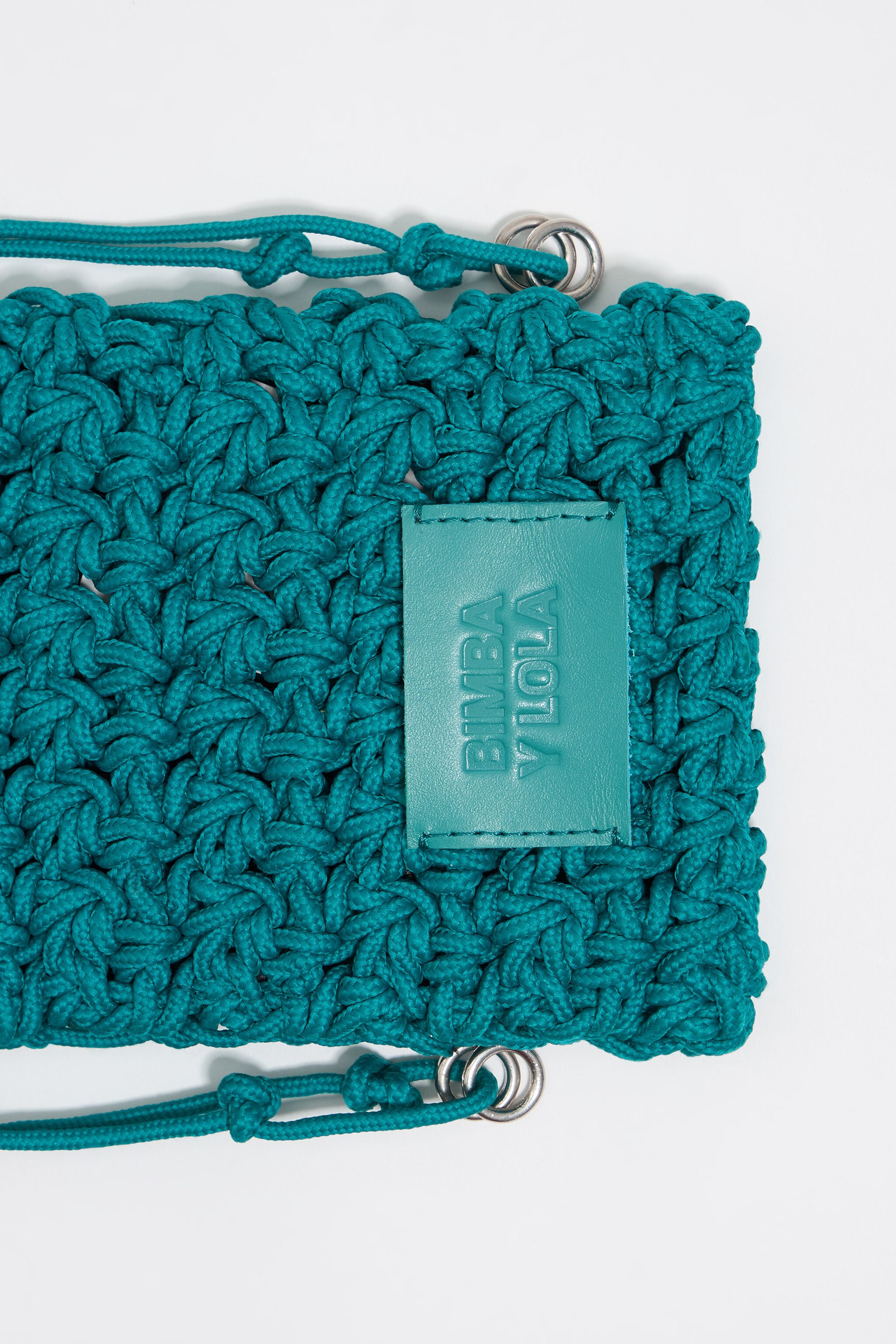 Mini turquoise plaited flat bag