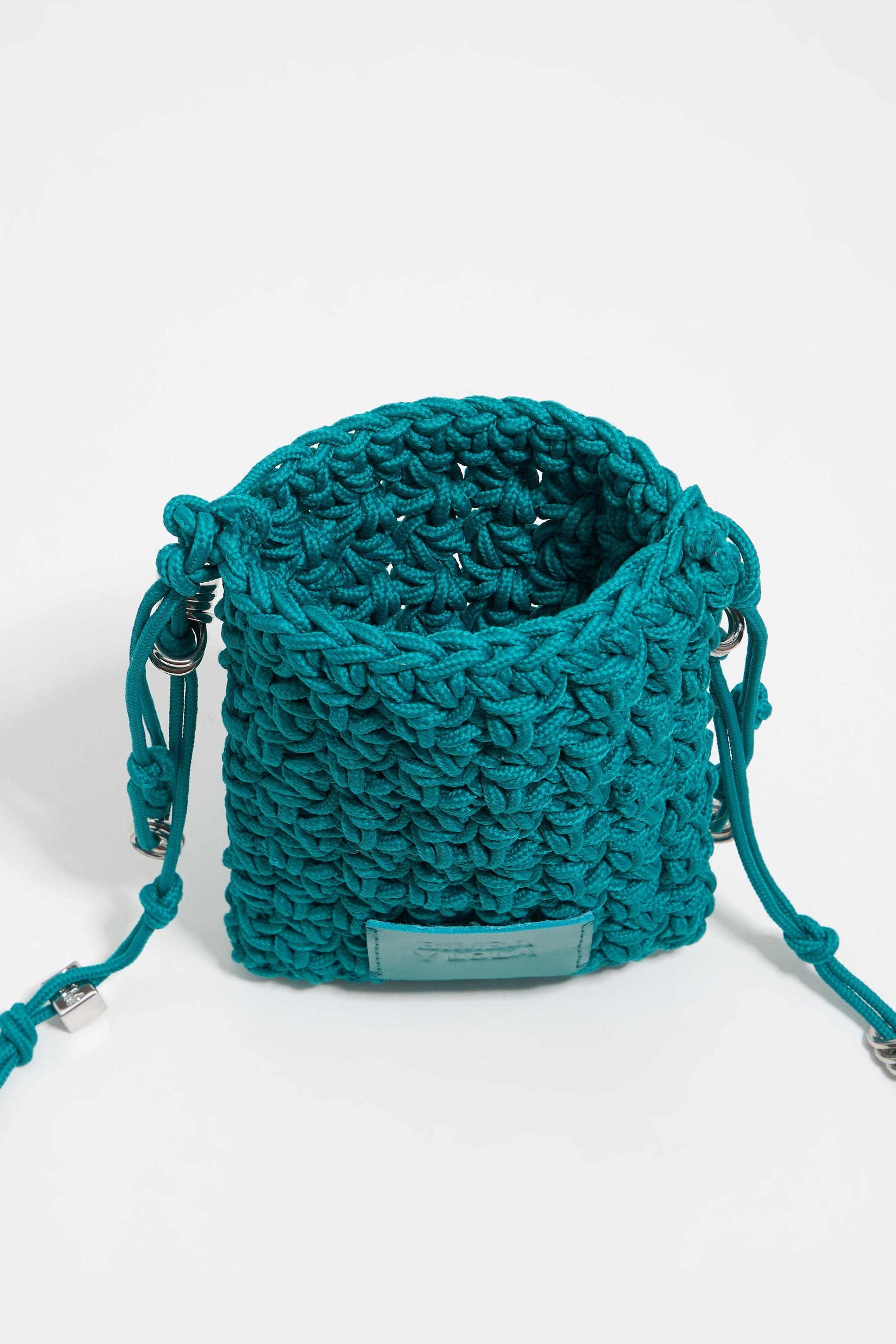 Mini turquoise plaited flat bag