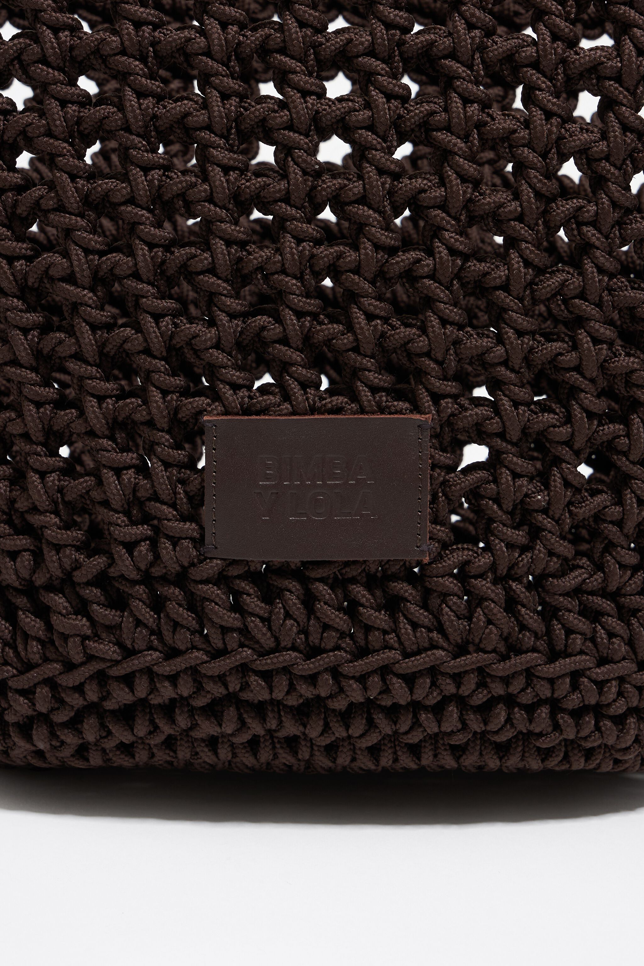 Dark brown plaited leather handbag