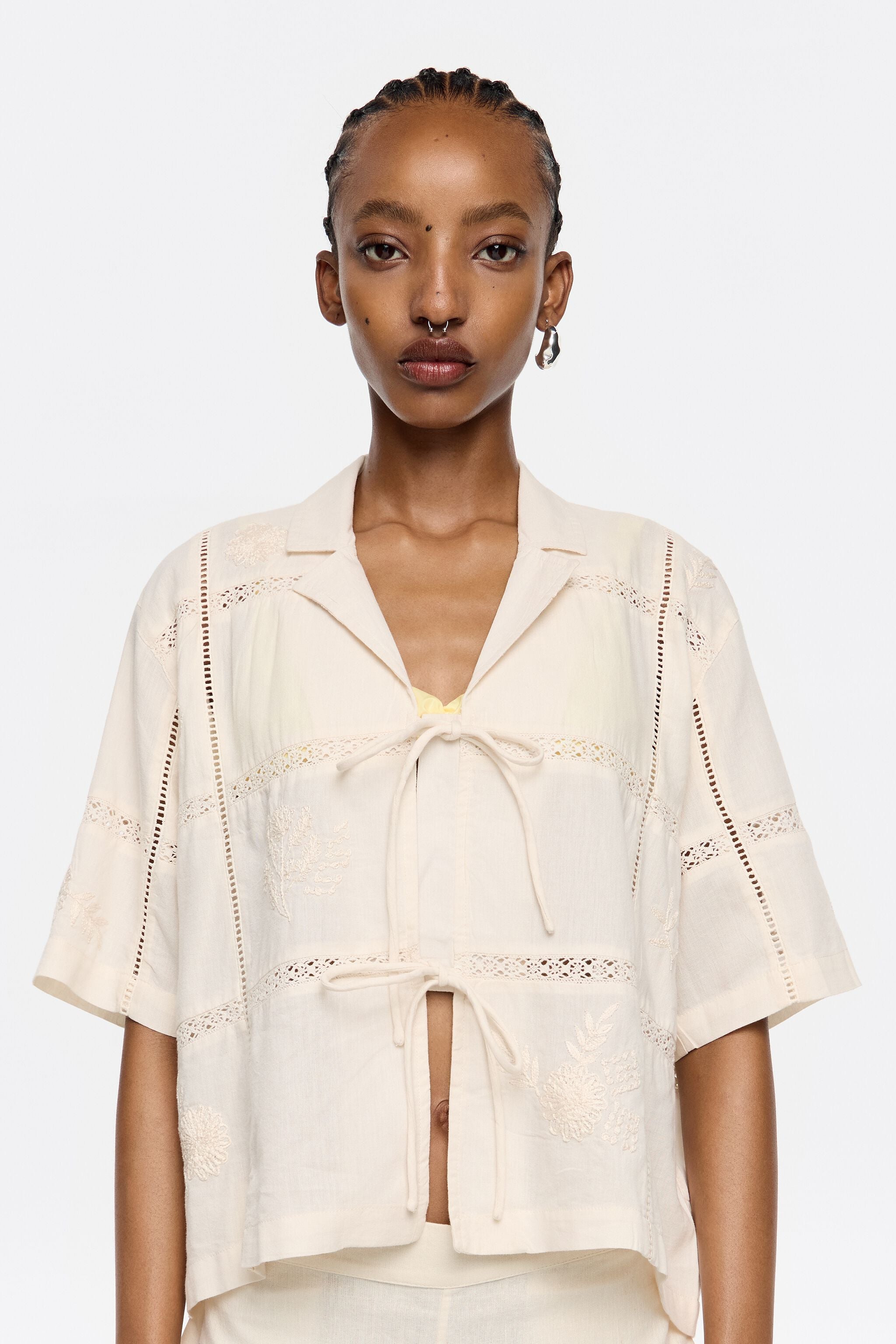 Cream shirt with bows and embroidery