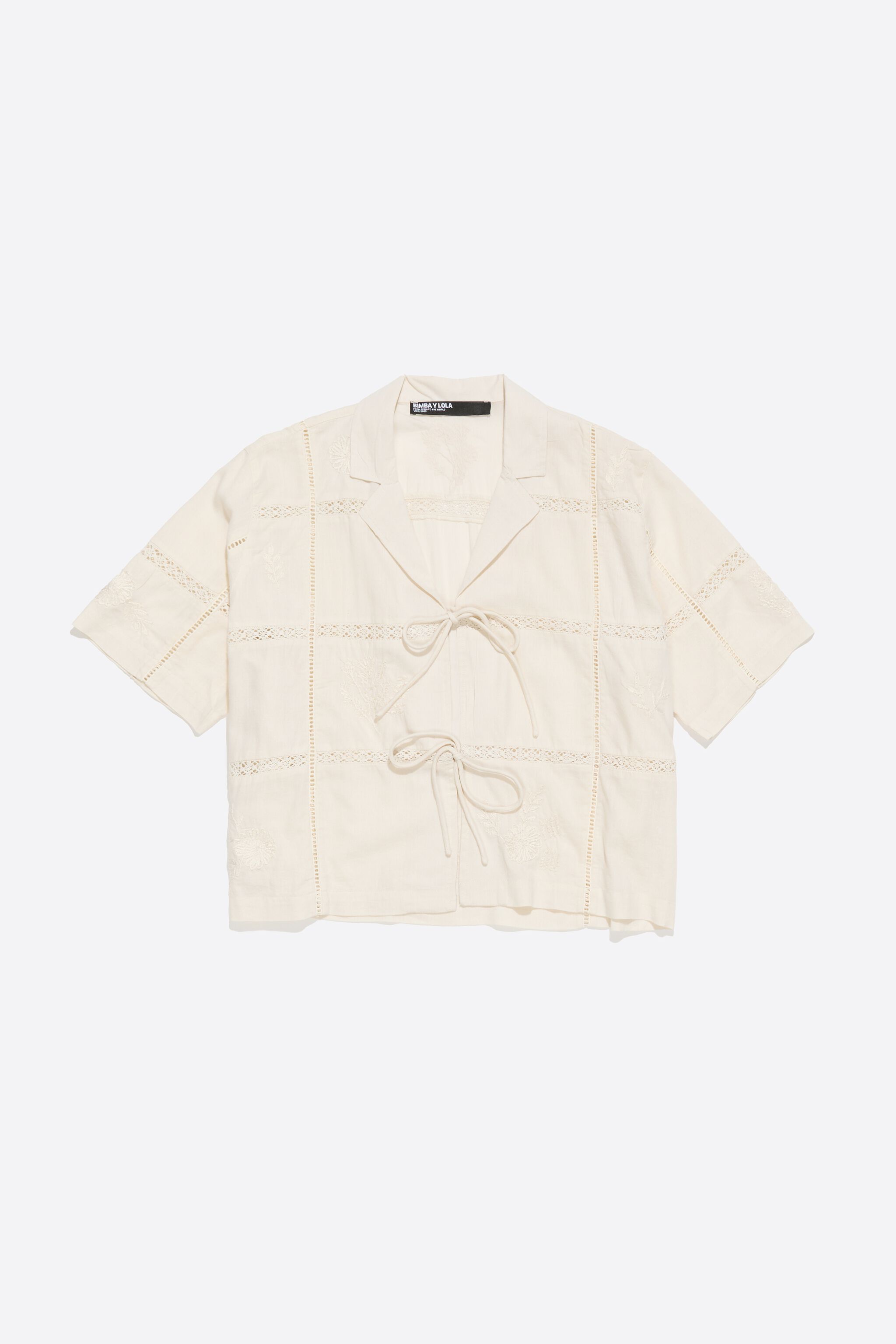 Cream shirt with bows and embroidery