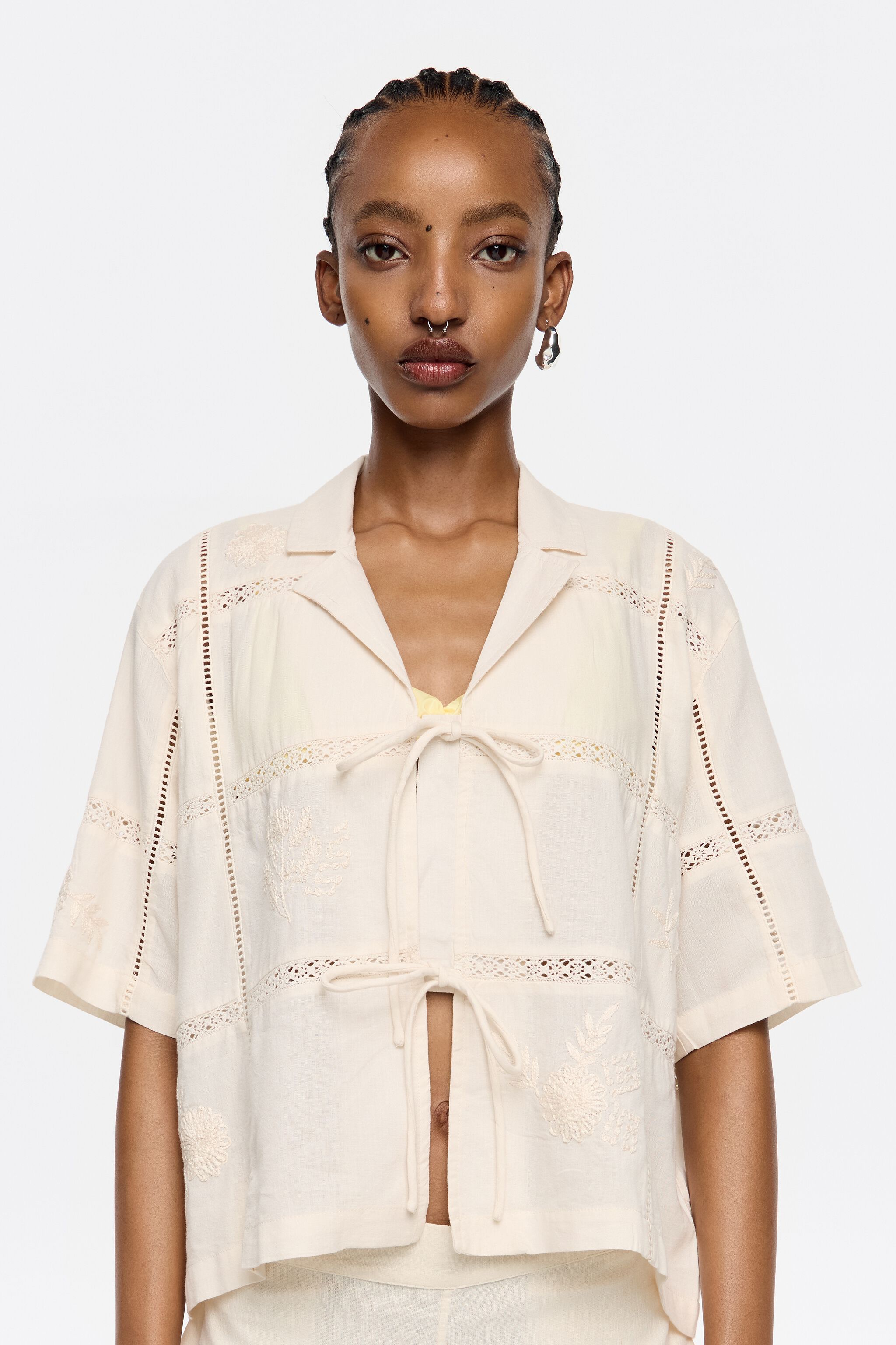Cream shirt with bows and embroidery