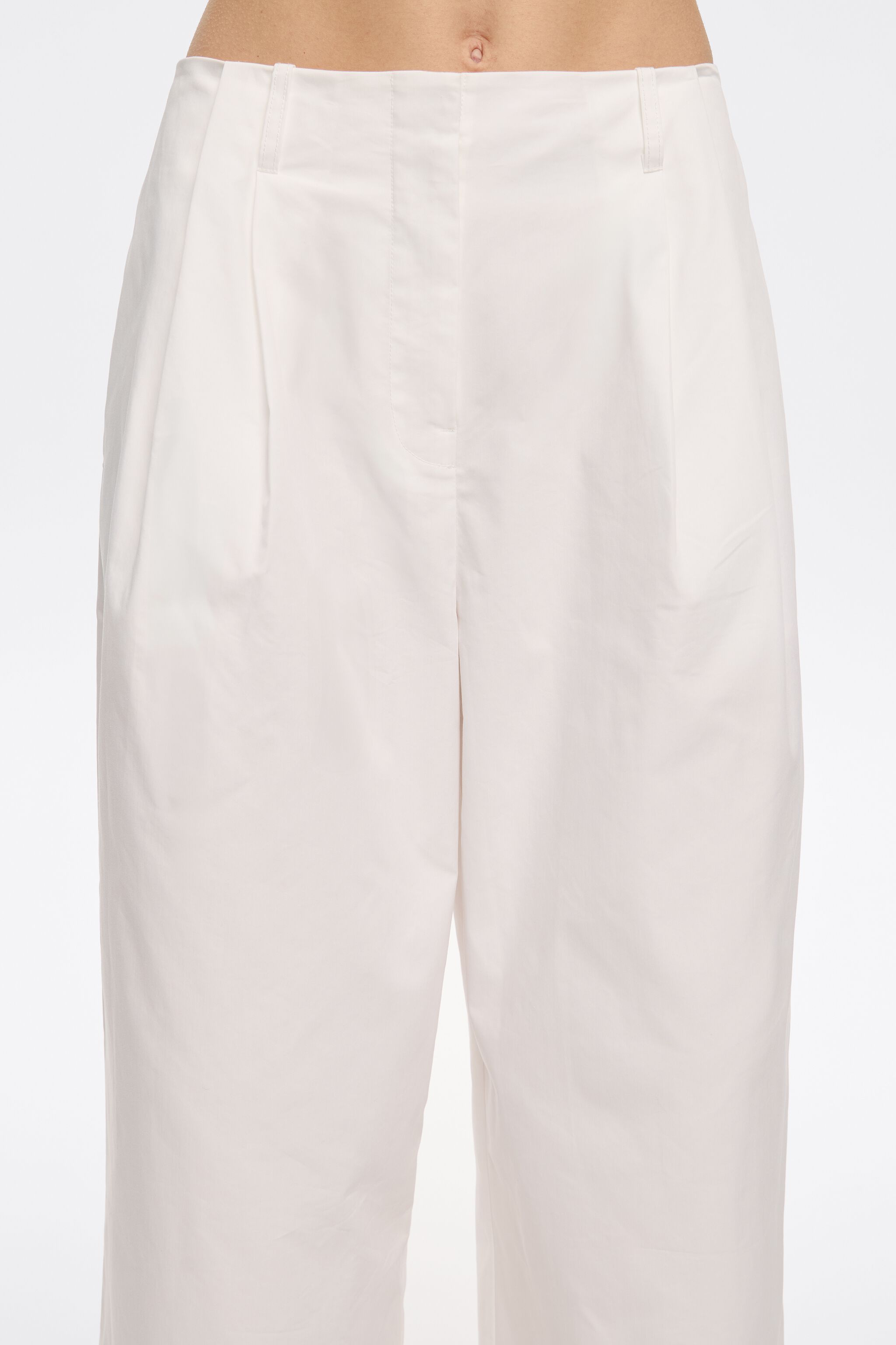 White darted ankle-length trousers