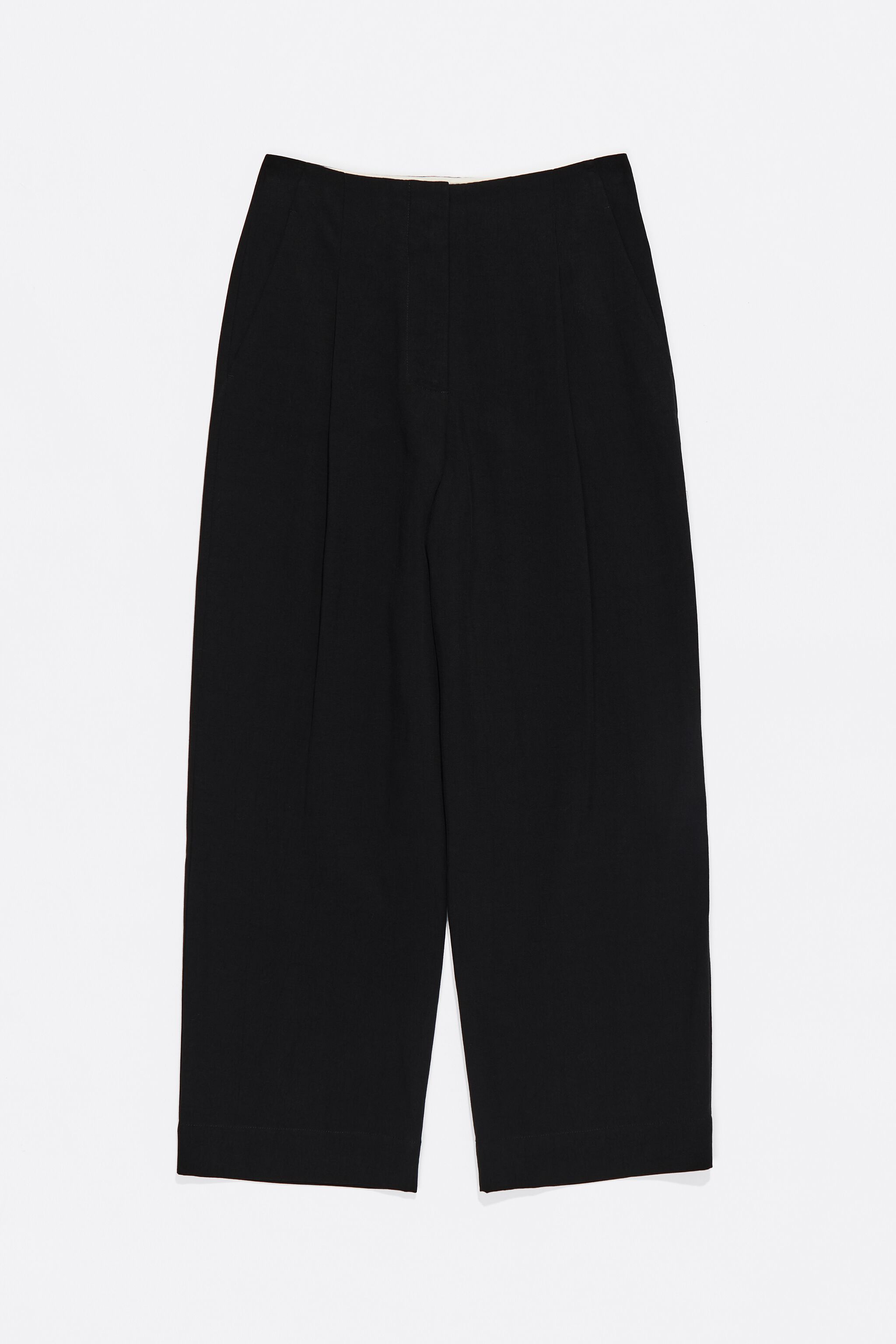 Black darted ankle-length trousers