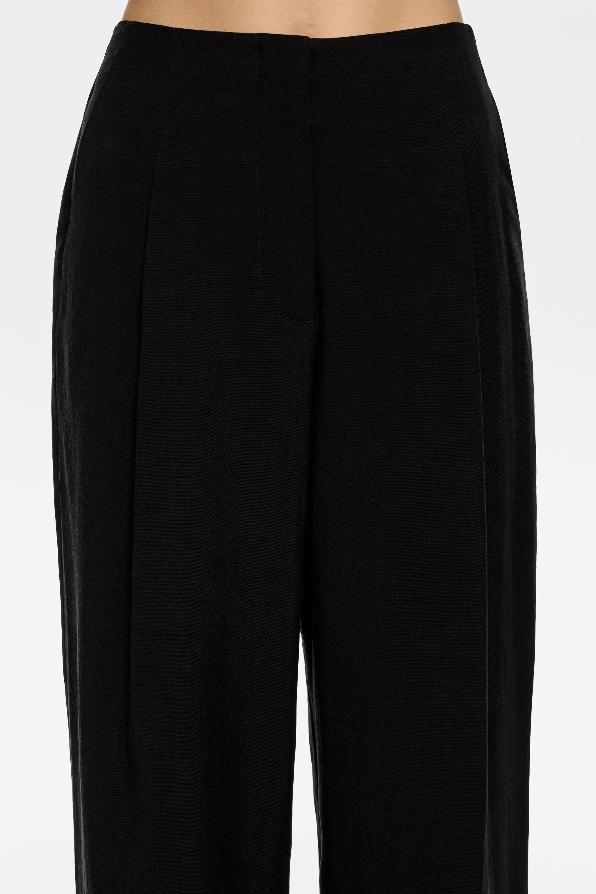 Black darted ankle-length trousers