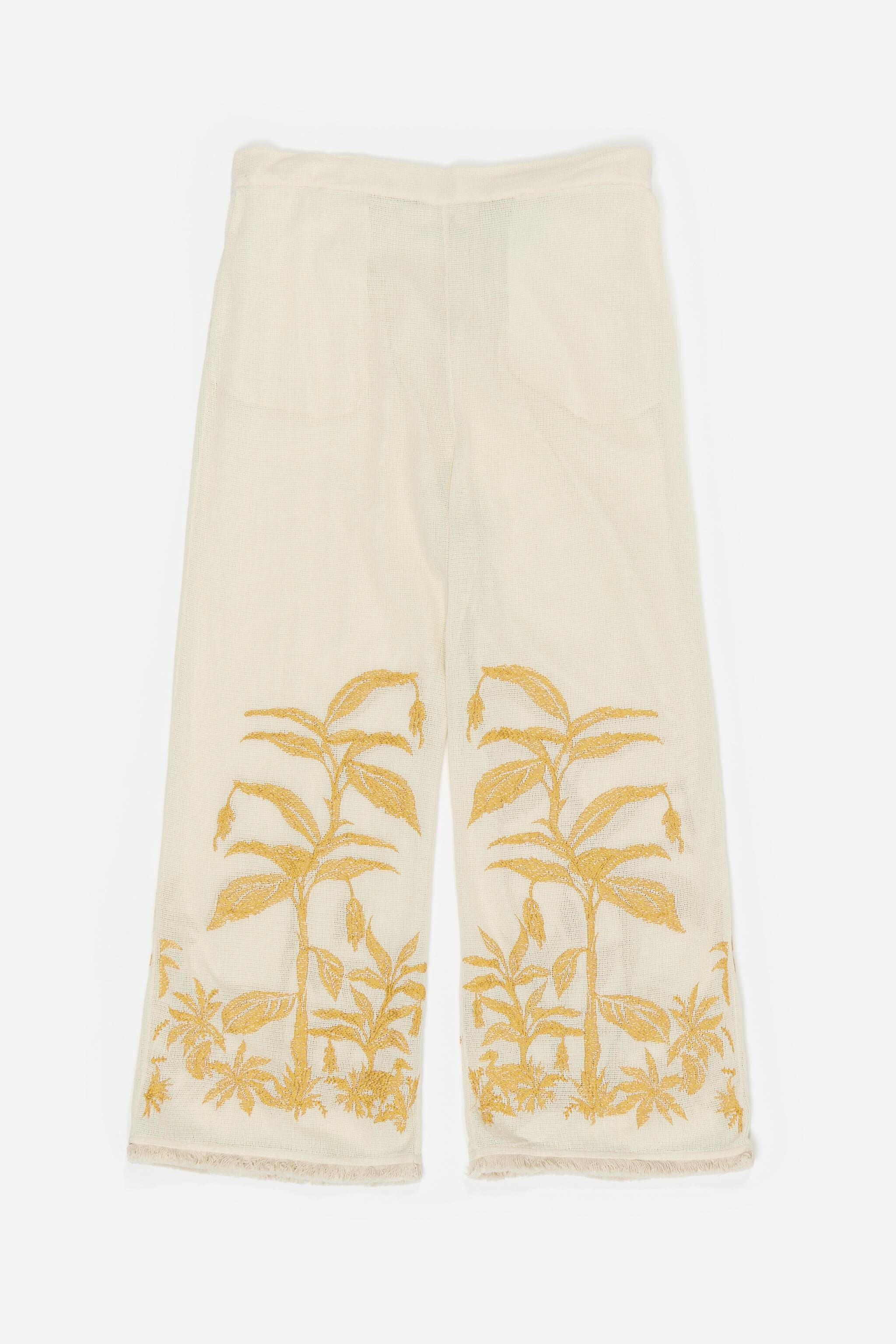 Straight vanilla trousers with embroidery and frayed details