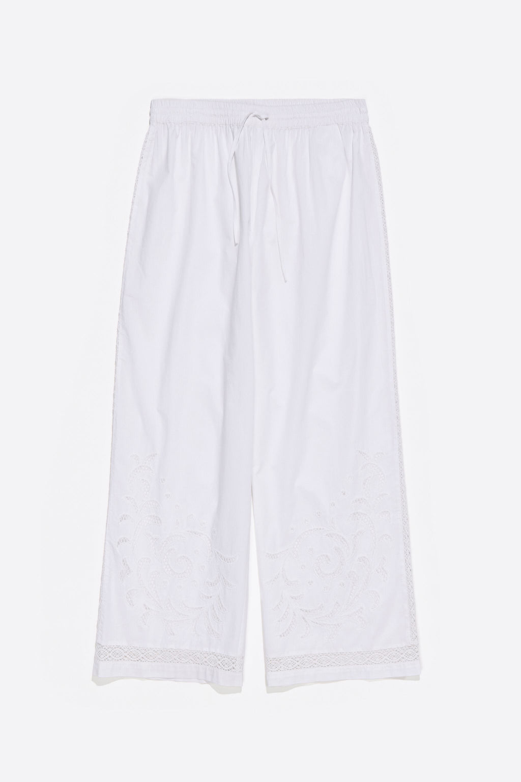 White embroidered jogger trousers