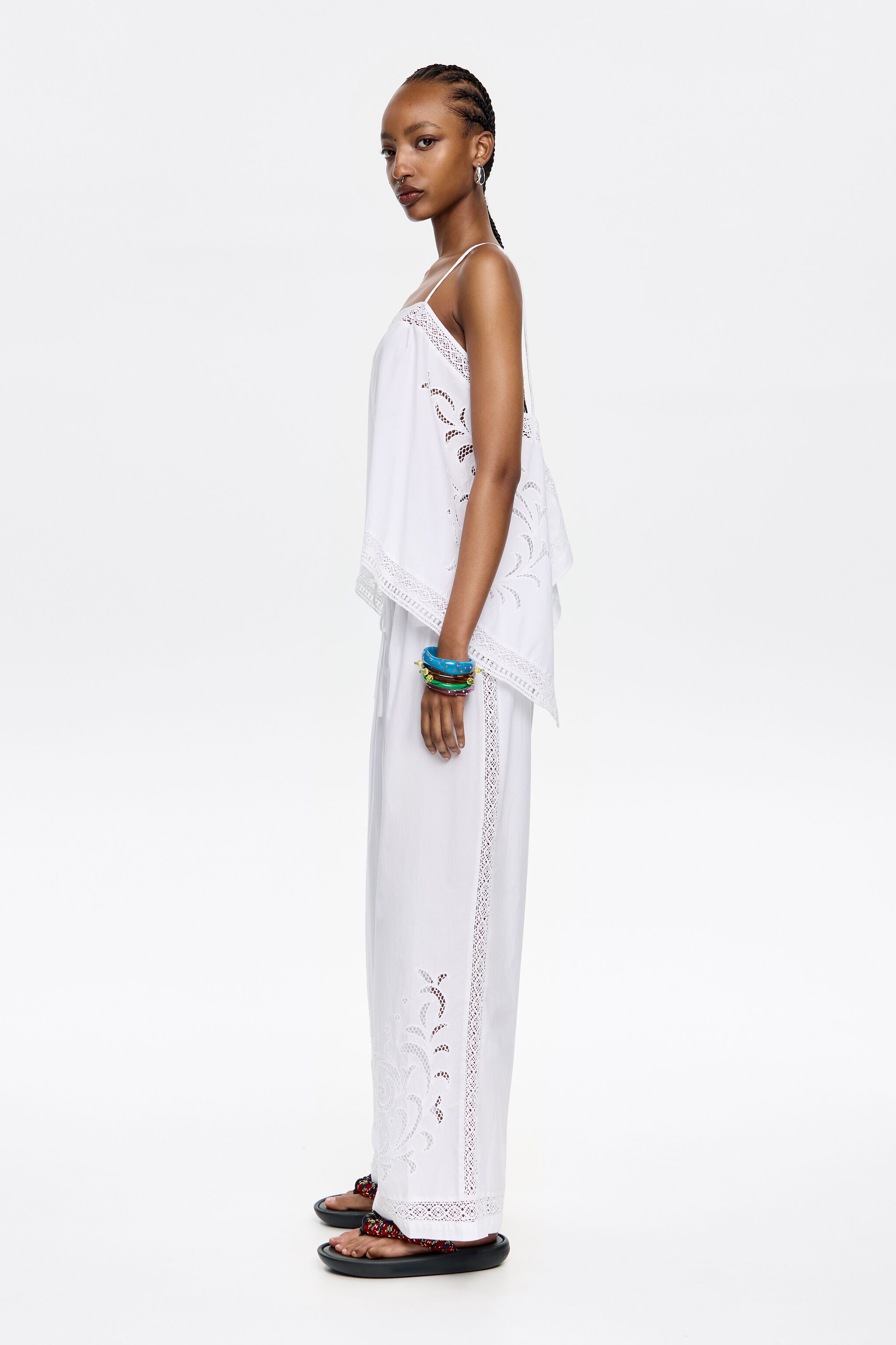 White embroidered jogger trousers