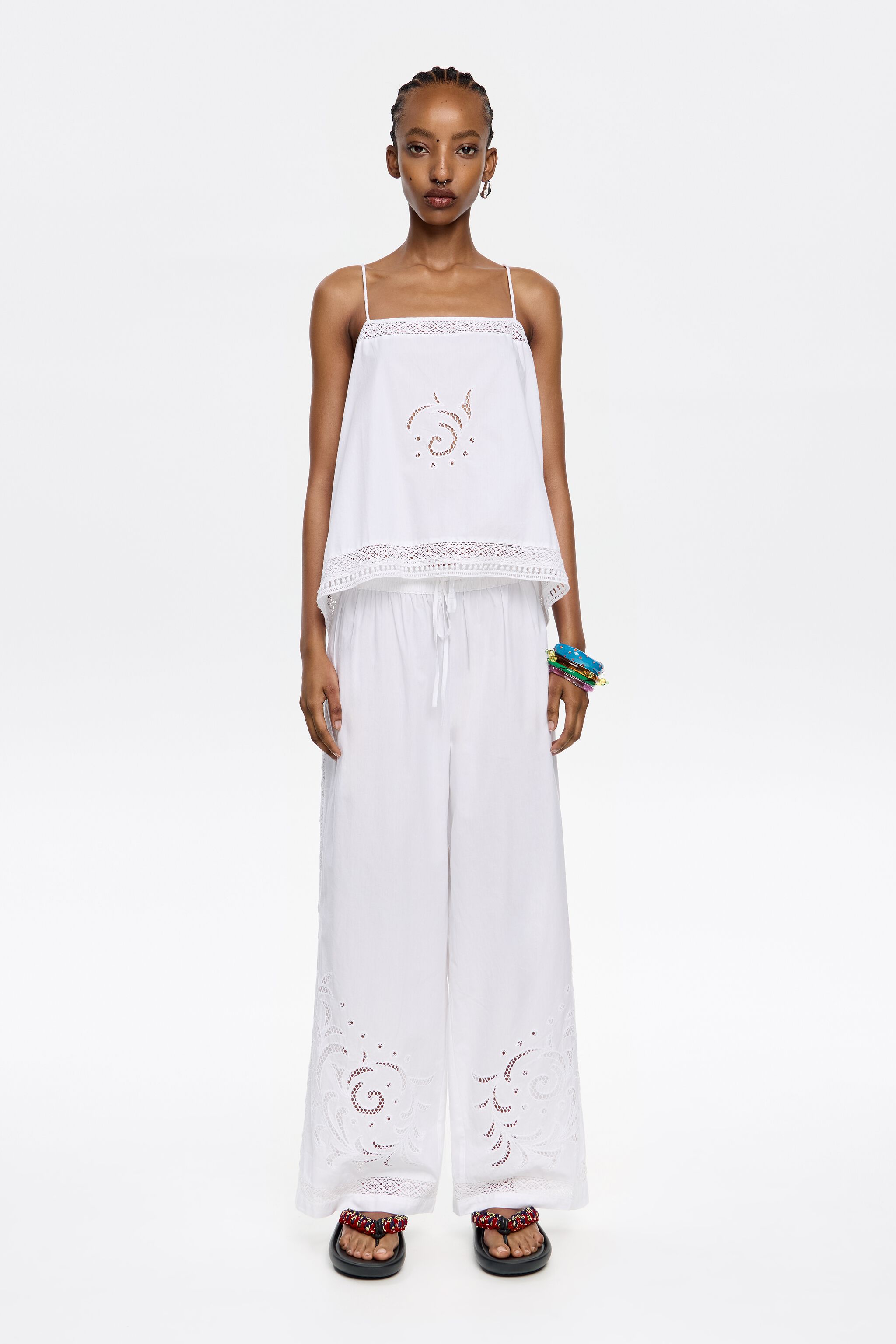 White embroidered jogger trousers