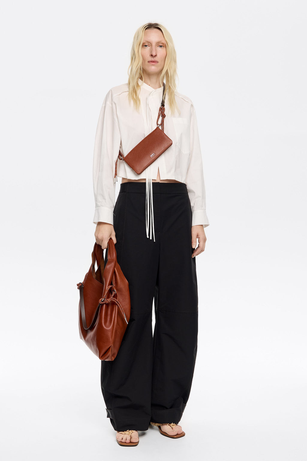 Black technical fabric barrel leg trousers