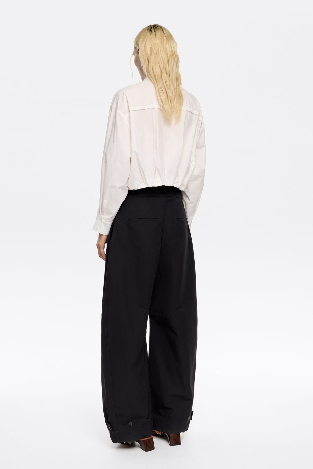 Black technical fabric barrel leg trousers