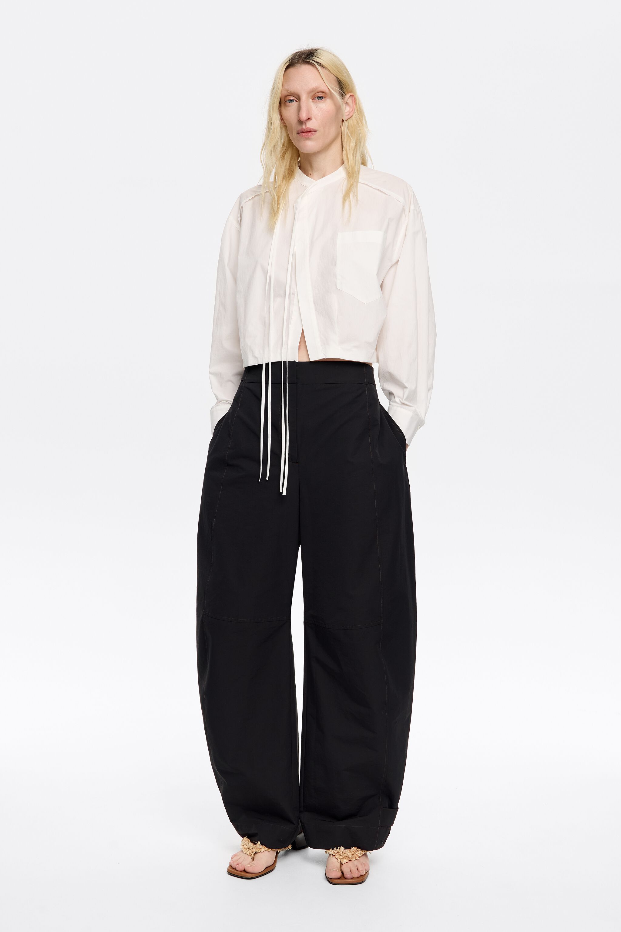 Black technical fabric barrel leg trousers
