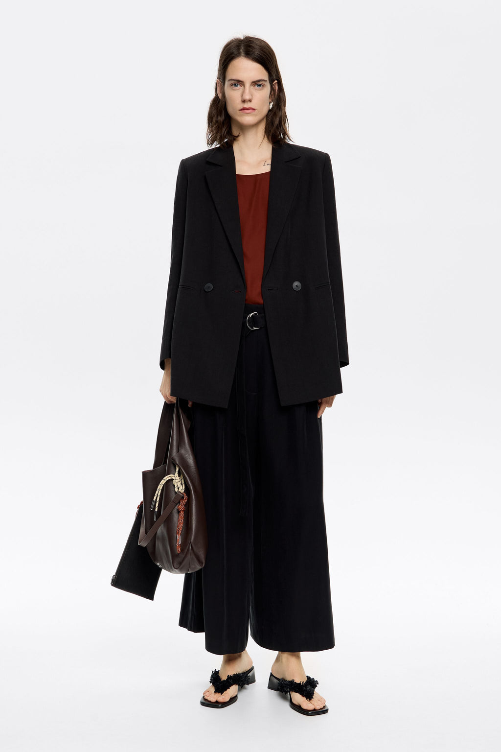 Black flared ankle-length trousers