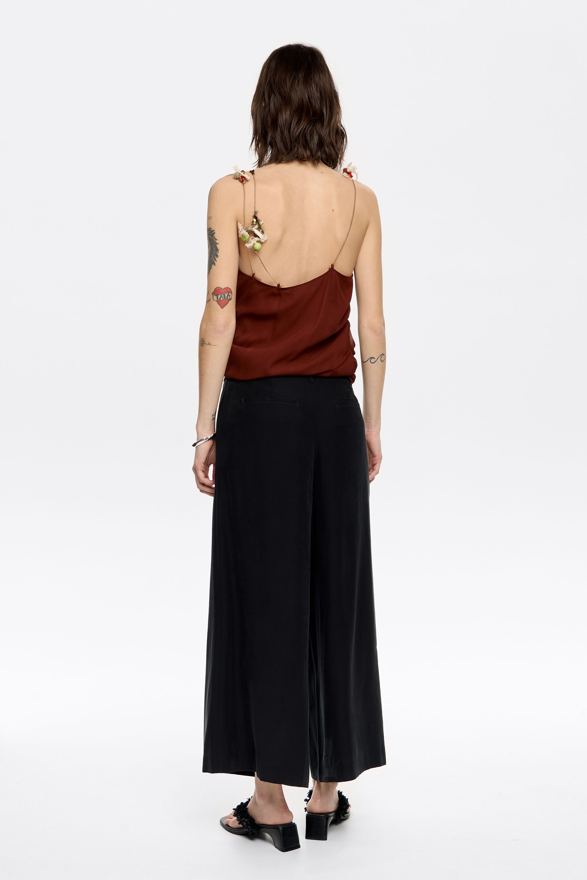 Black flared ankle-length trousers