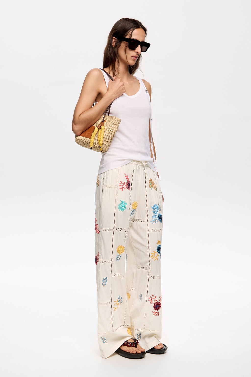 Cream jogger trousers with multicolor embroidery