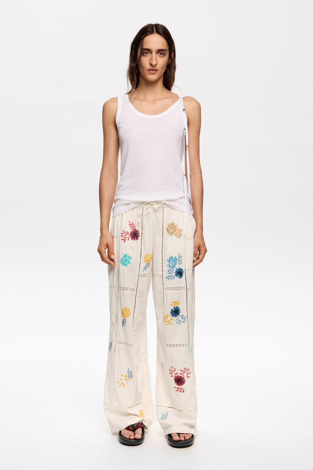 Cream jogger trousers with multicolor embroidery