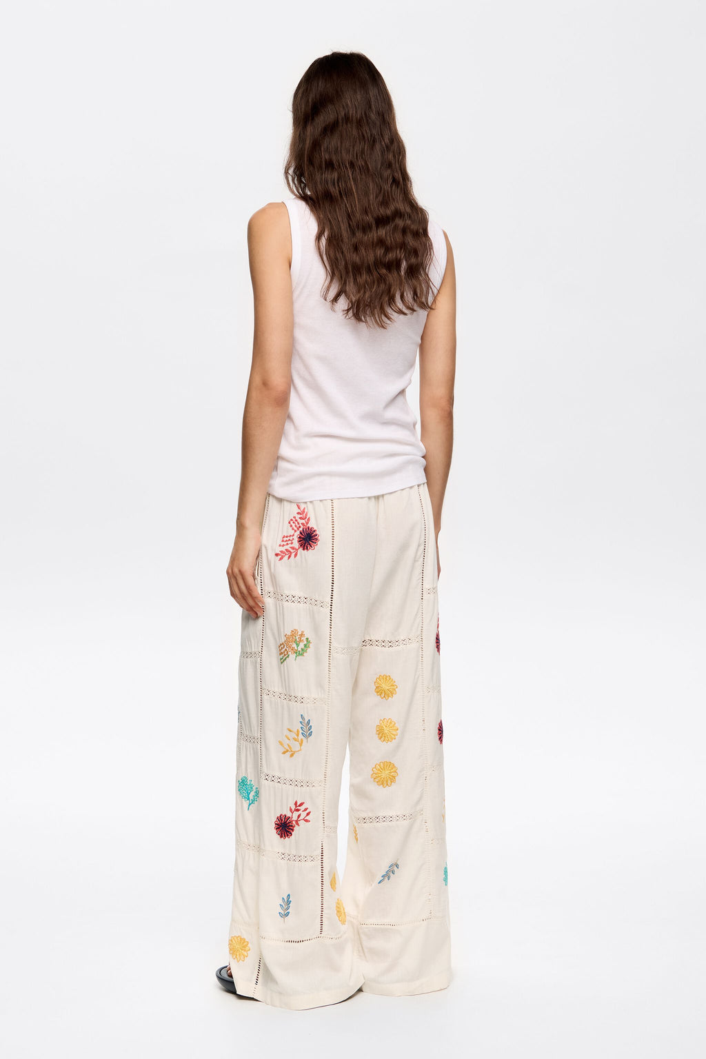 Cream jogger trousers with multicolor embroidery