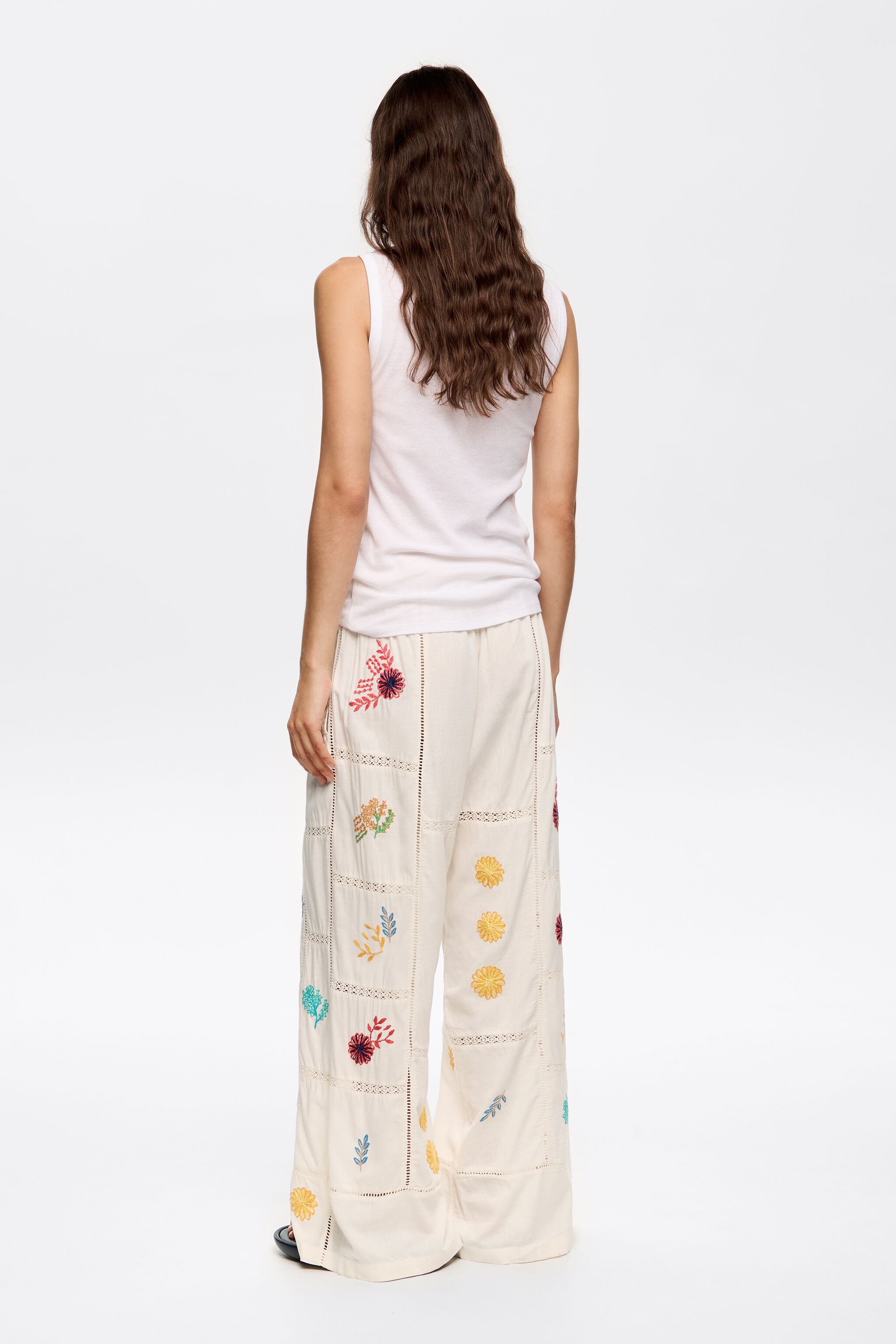 Cream jogger trousers with multicolor embroidery