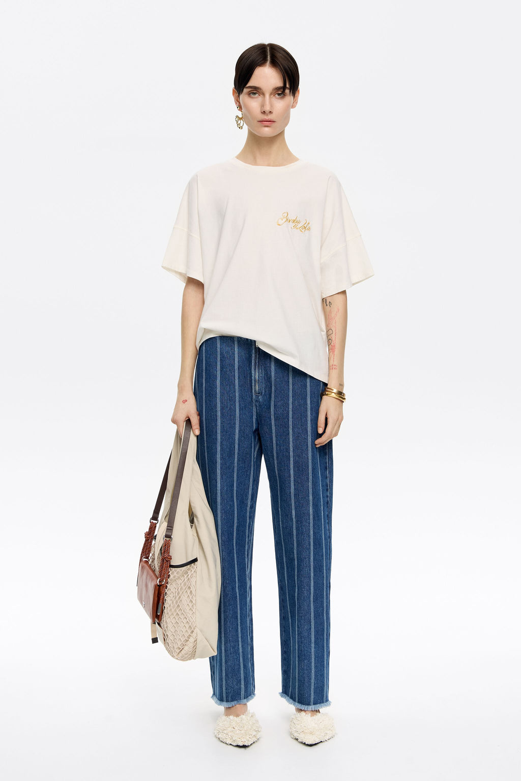 Blue striped frayed denim trousers